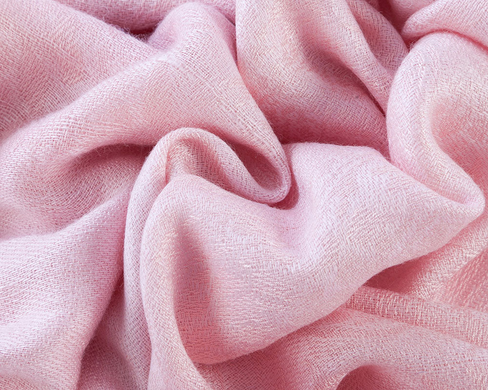 A soft and elegant Baby Pink Pashmina with fringe, perfect for wrapping or draping over dresses.