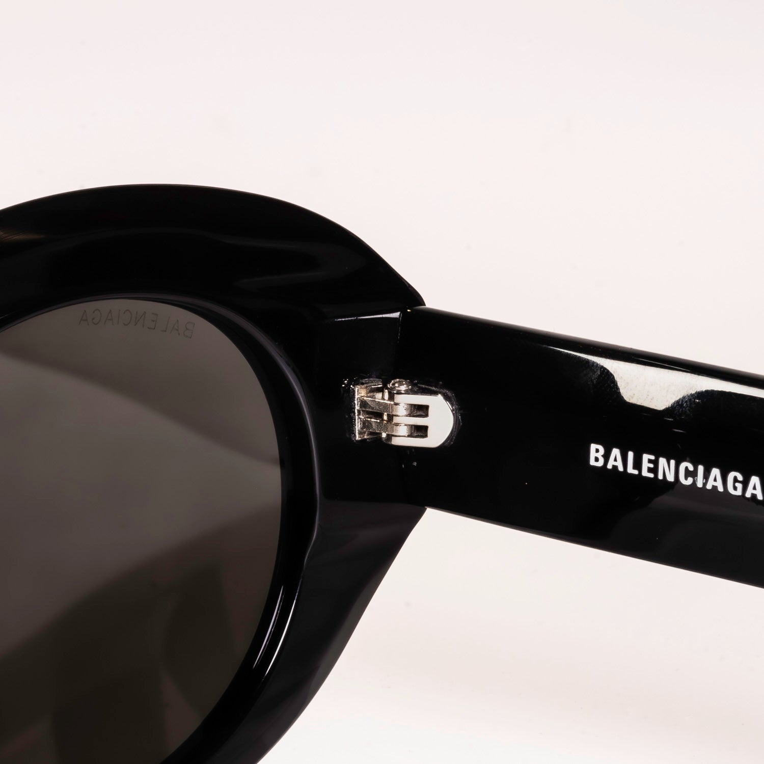 BALENCIAGA SUNGLASSES BB0235S featuring round brown or black lenses and a full rim acetate frame, stylishly displayed in a protective case.