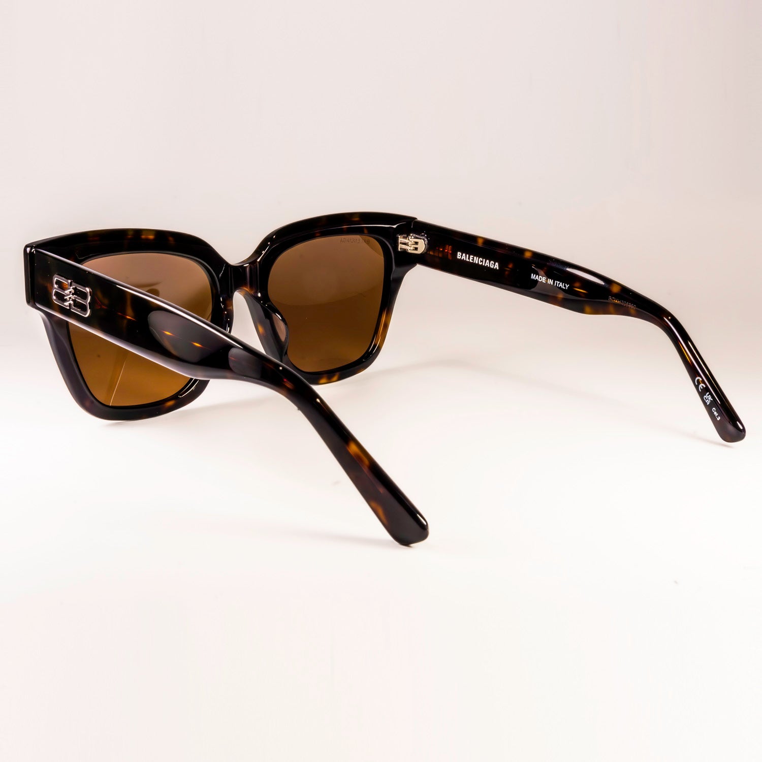 BALENCIAGA SUNGLASSES BB0237SA featuring a sleek black plastic frame and black-grey lenses, designed for style and UV protection.