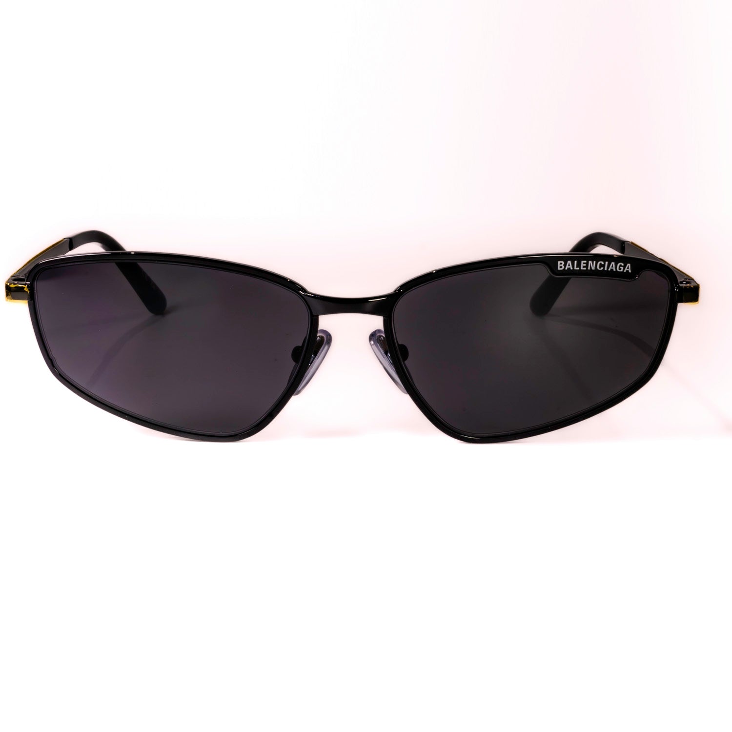 BALENCIAGA SUNGLASSES BB0277S 001 featuring a black metal frame and tinted lenses, showcasing luxury and style.