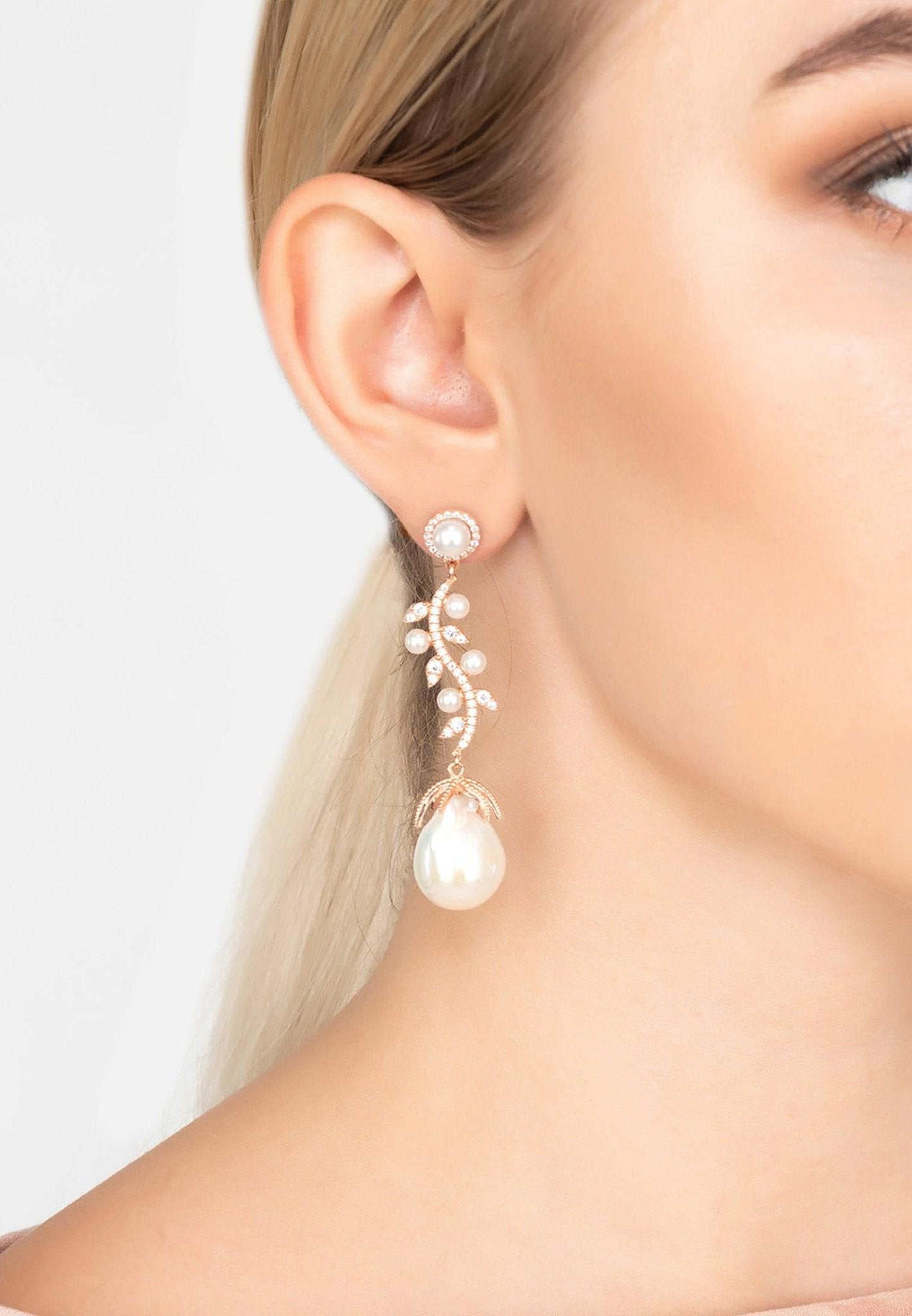 Baroque Pearl Trailing Flowers Earrings in Silver featuring unique baroque pearls and sparkling cubic zirconia stones, elegantly designed for any occasion.