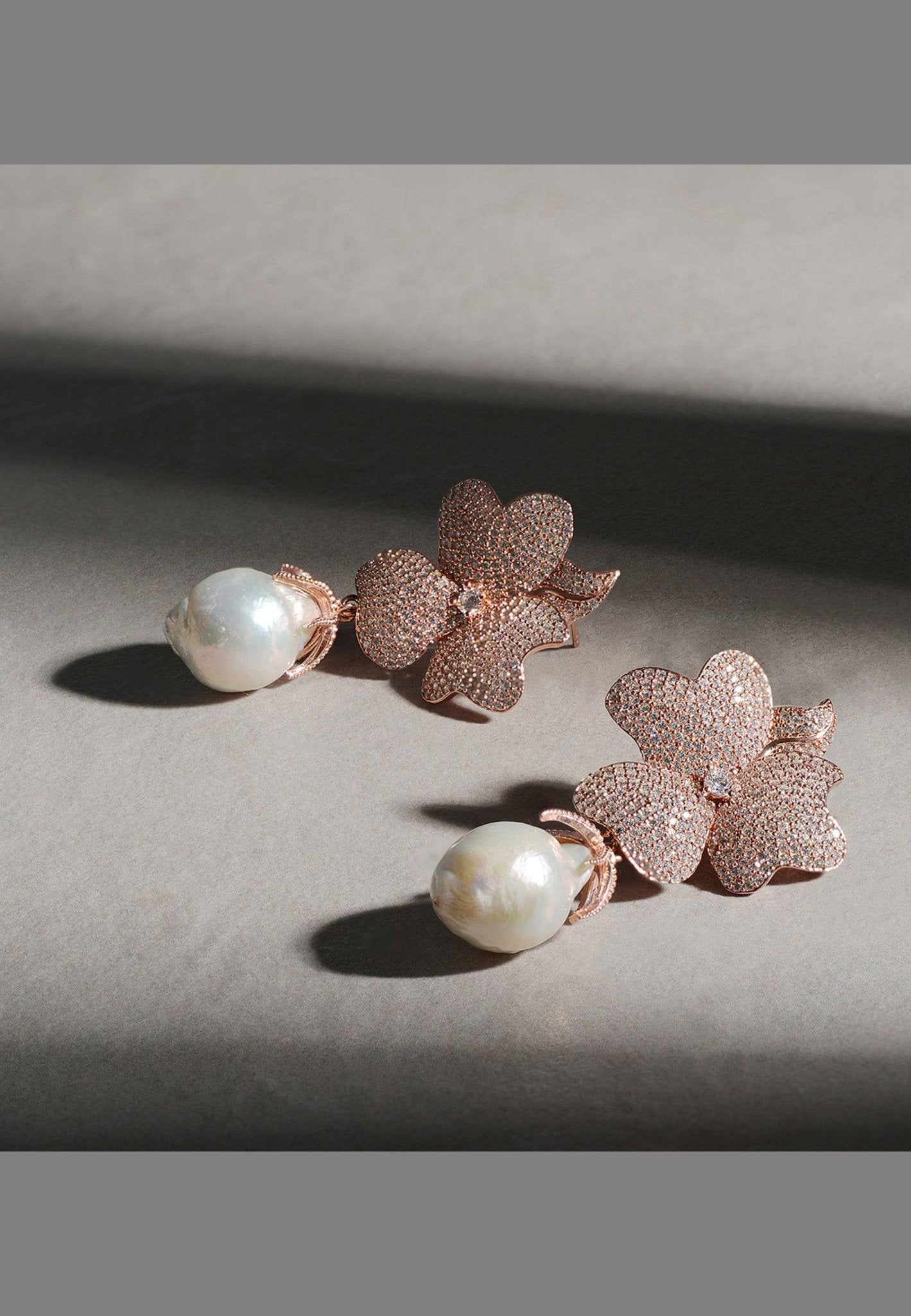 Baroque Pearl White Flower Drop Earrings in silver featuring floral tops and hanging baroque pearls.