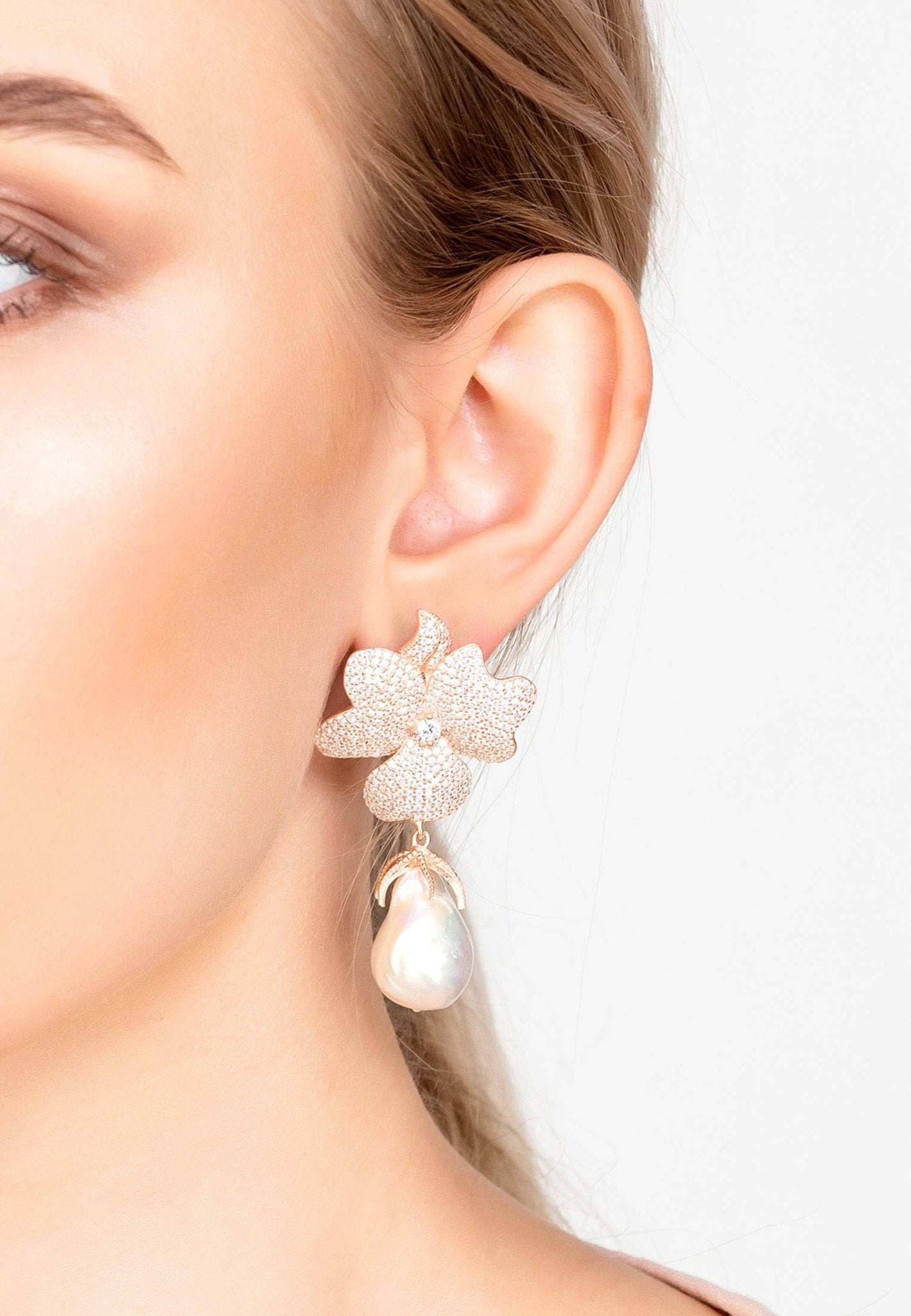 Baroque Pearl White Flower Drop Earrings featuring floral tops and sparkling cubic zirconia, crafted in rosegold.