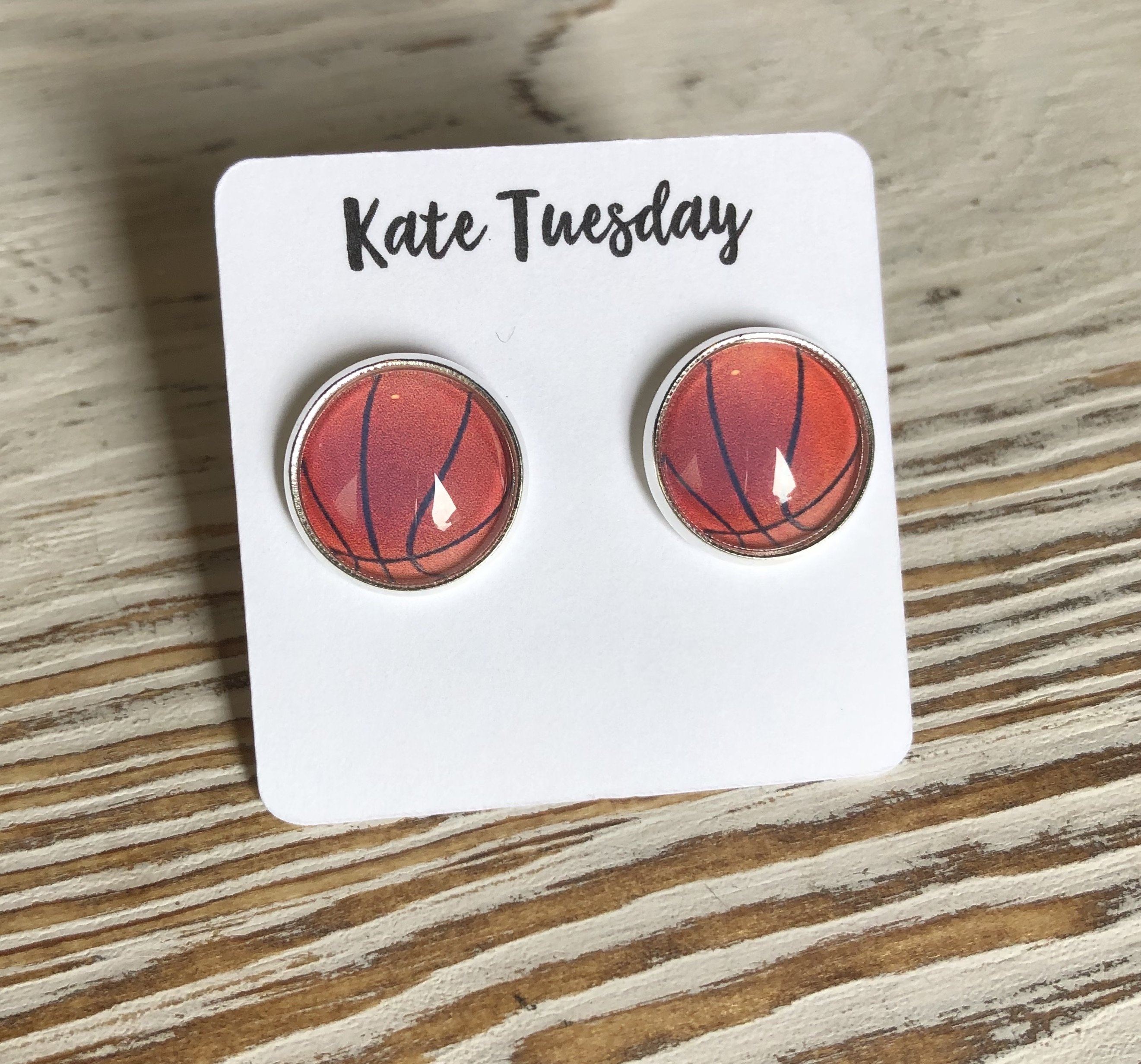 A pair of 12mm basketball sport stud earrings, showcasing a stylish design perfect for basketball enthusiasts.