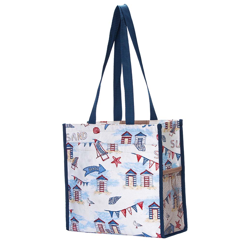 Beach Hut Shopper Bag made from eco dyed yarn, featuring zip and velcro pockets, patterned nylon lining, and sturdy handles.