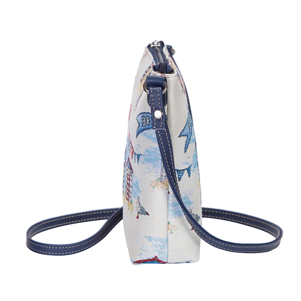 Beach Hut Sling Bag featuring a charming seaside design with sun loungers and seashells, made from eco-friendly materials.