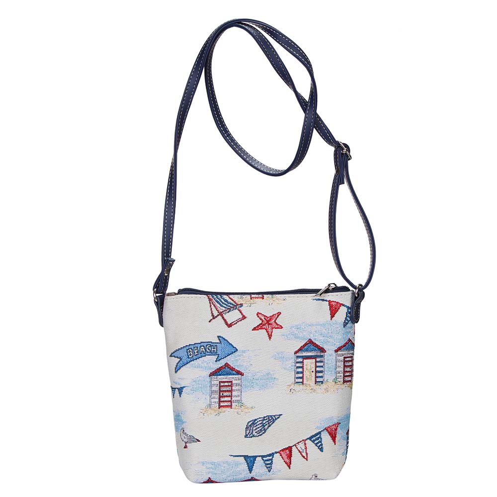 Beach Hut Sling Bag featuring a charming seaside design with sun loungers and seashells, made from eco-friendly materials.