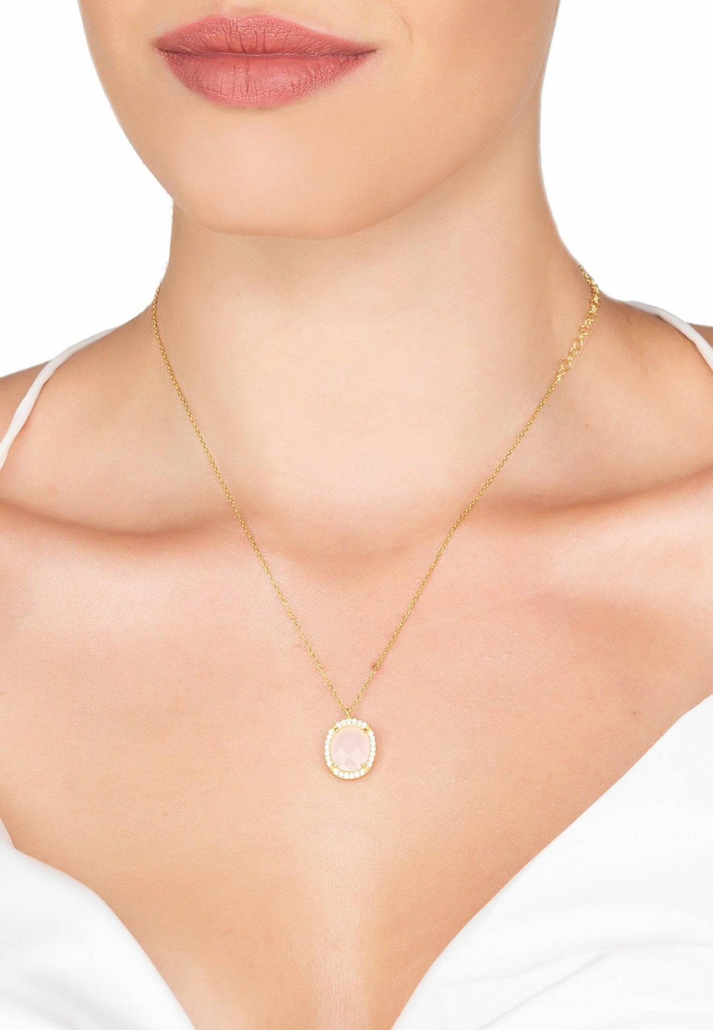 Beatrice Oval Gemstone Pendant Necklace featuring a rose quartz centerpiece surrounded by cubic zirconia, elegantly crafted in gold and silver.