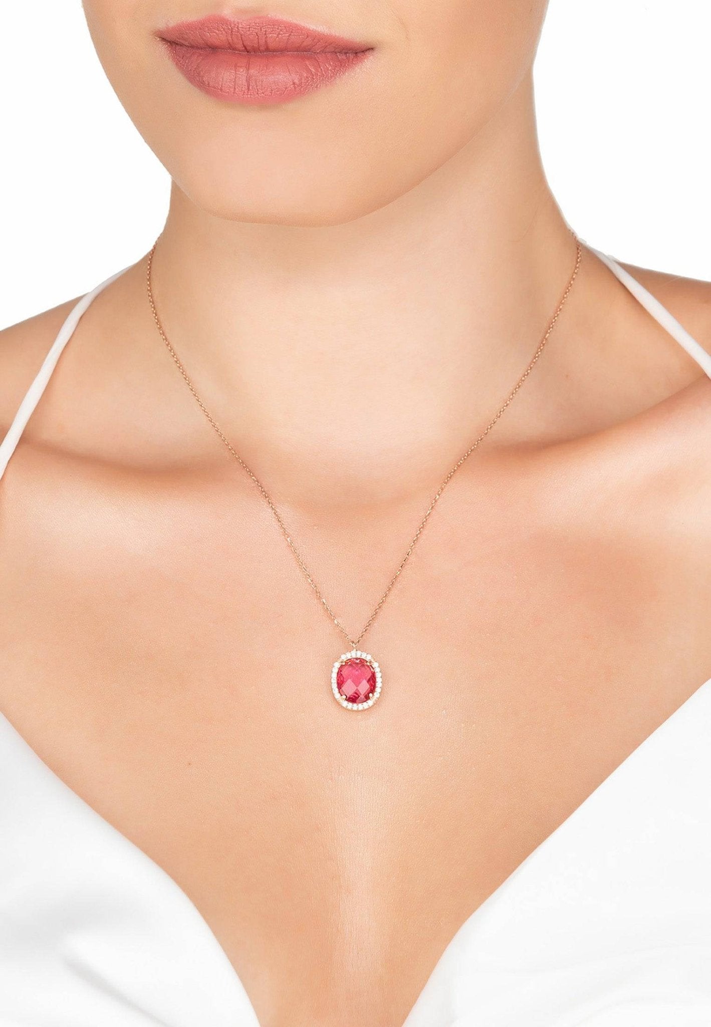 Beatrice Oval Gemstone Pendant Necklace in rose gold featuring a pink tourmaline stone surrounded by cubic zirconia accents.