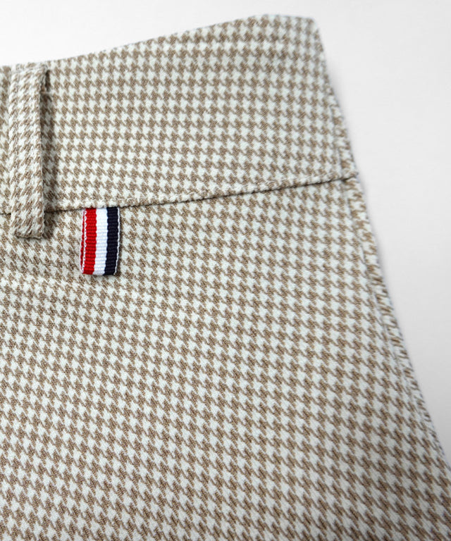 BENECIA 12 Unbalanced Check Skirt in Beige, featuring a stylish check pattern and a comfortable fit, perfect for various occasions.