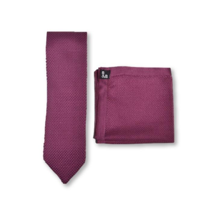 Berry pink knitted tie and pocket square set displayed elegantly, showcasing the vibrant color and texture.