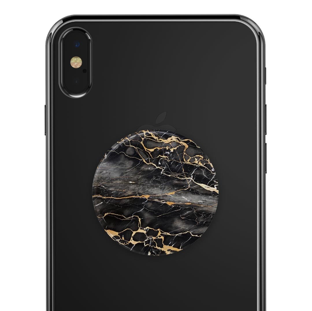 Black and Gold Marble Surface Skin Kit for PopSockets, showcasing a stylish marble design on a smartphone grip.