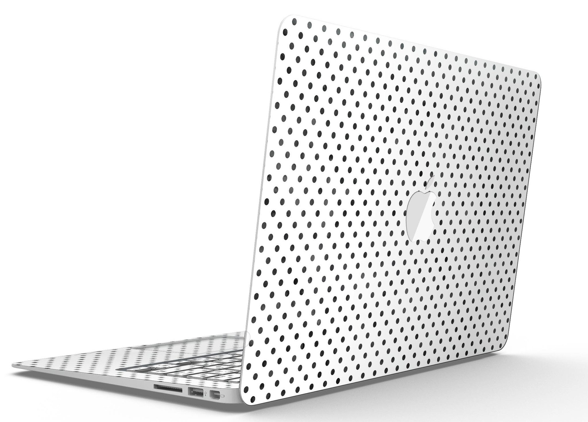 Black and gray fade polka dots skin kit for MacBook Air, showcasing a stylish design that protects the device from scratches.