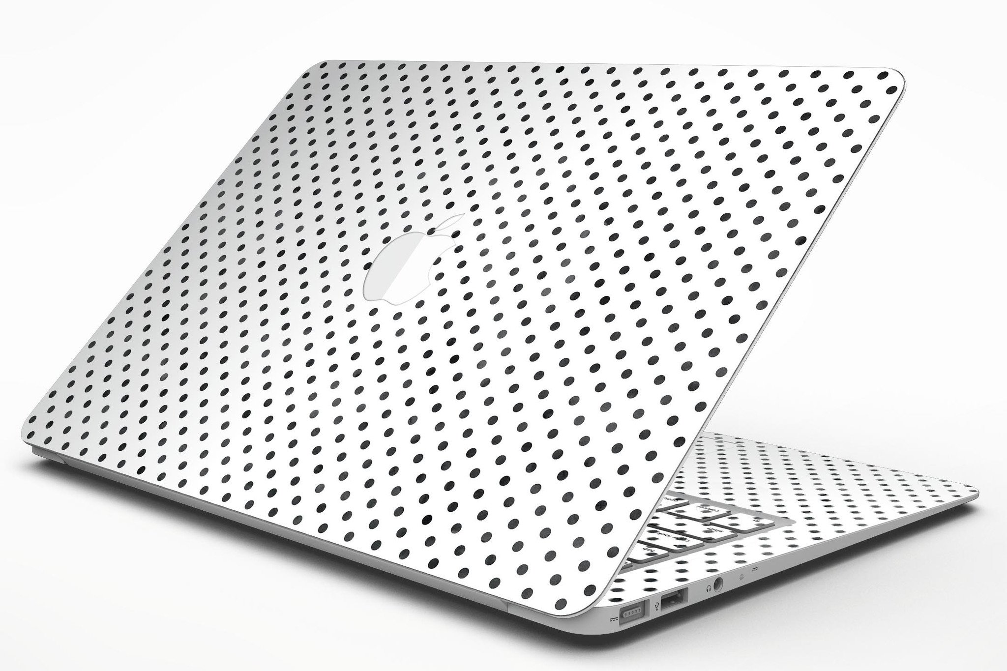 Black and gray fade polka dots skin kit for MacBook Air, showcasing a stylish design that protects the device from scratches.