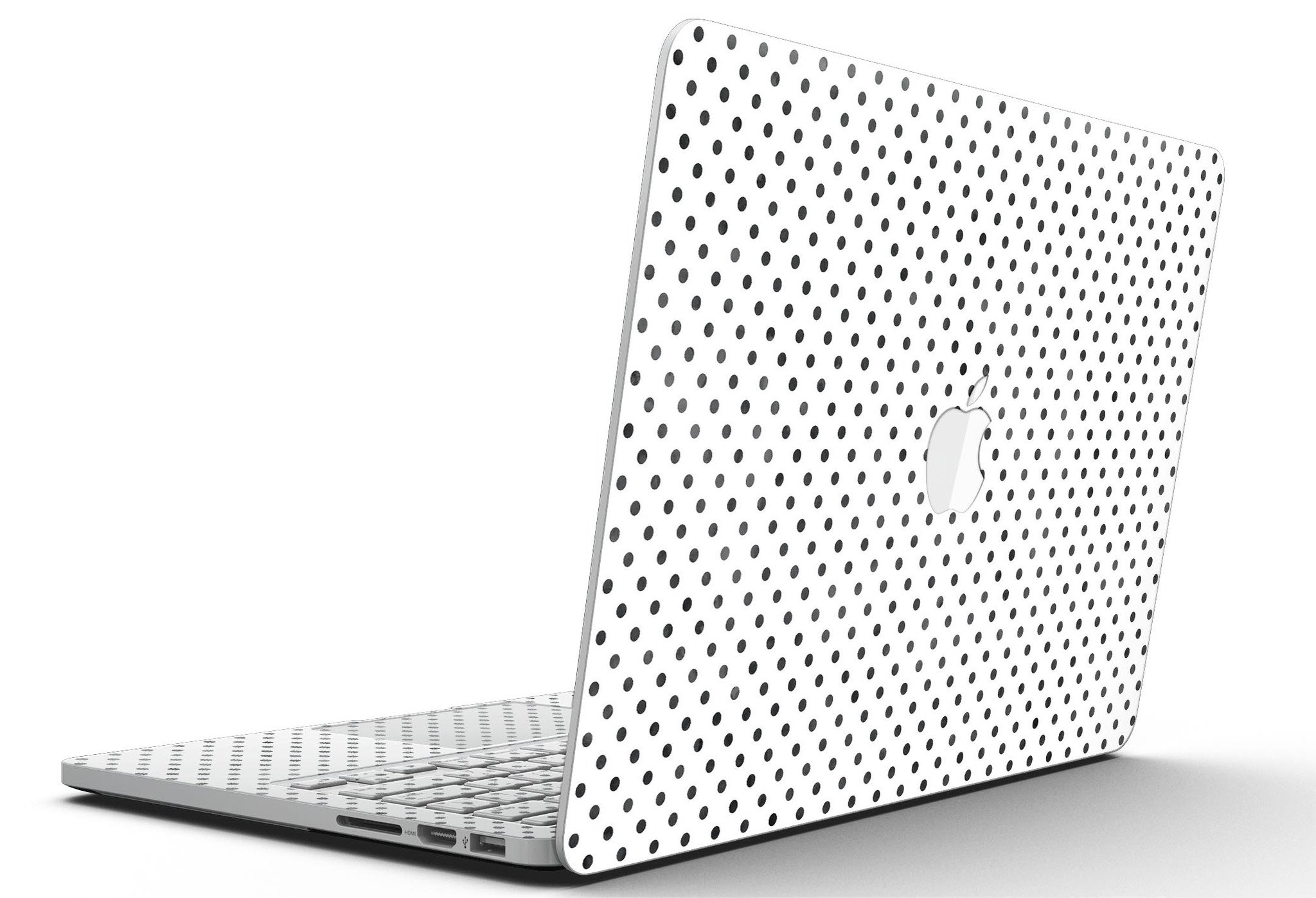 Black and gray fade polka dots skin for MacBook Pro with Retina Display, showcasing a stylish design that protects the device.