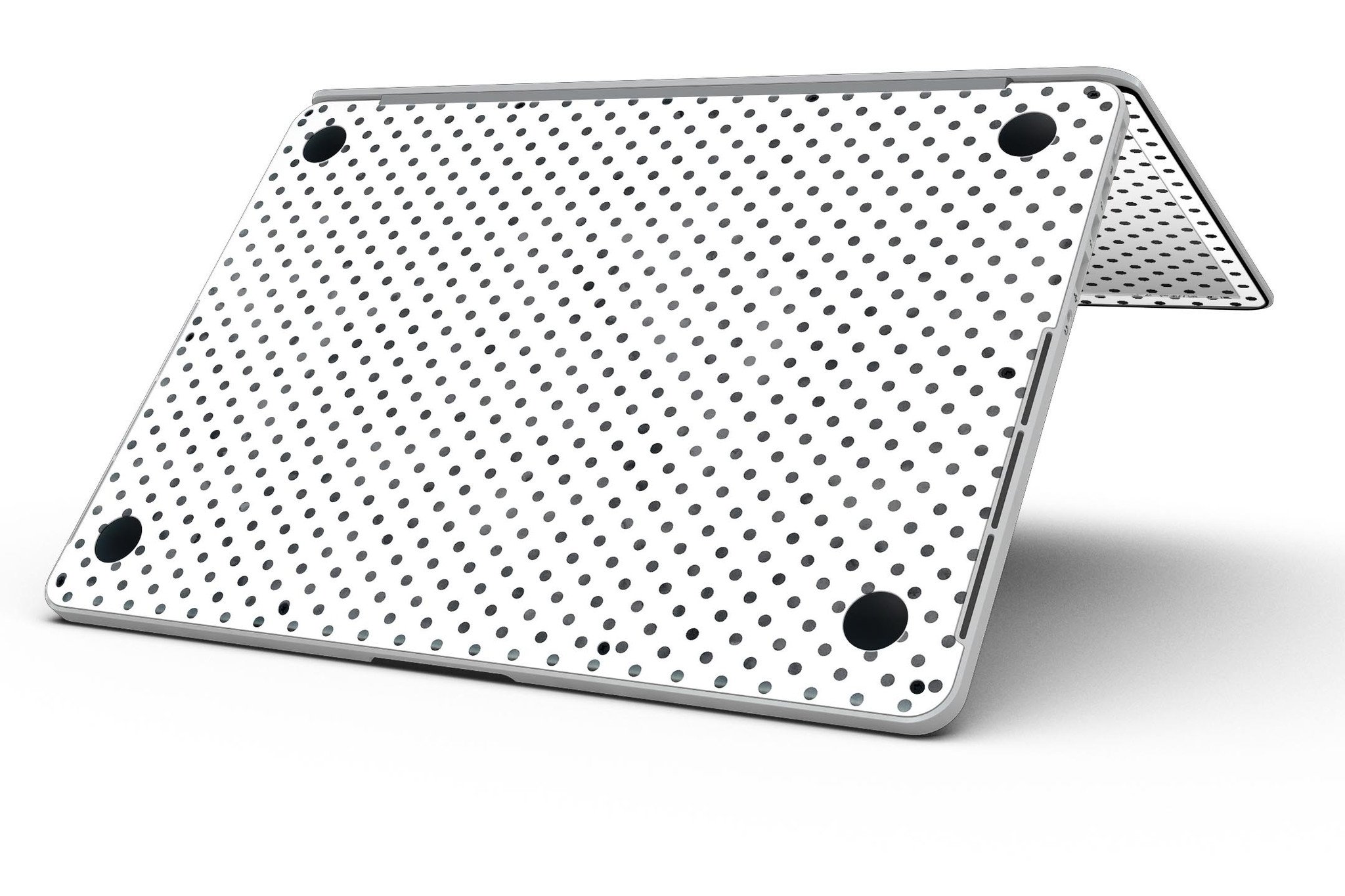 Black and gray fade polka dots skin for MacBook Pro with Retina Display, showcasing a stylish design that protects the device.