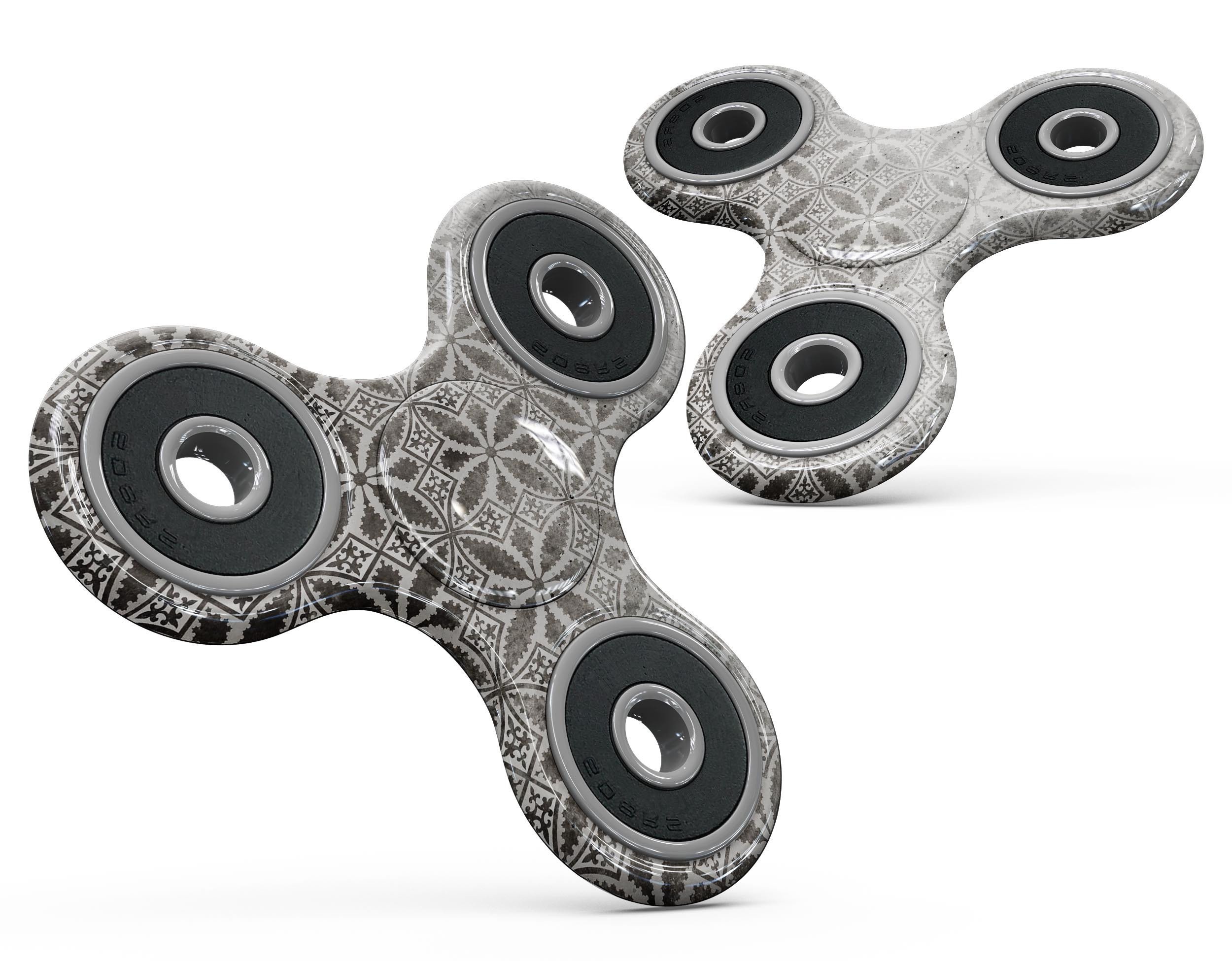 Black and gray floral cross pattern skin kit for fidget spinner, showcasing a stylish design and premium vinyl material.