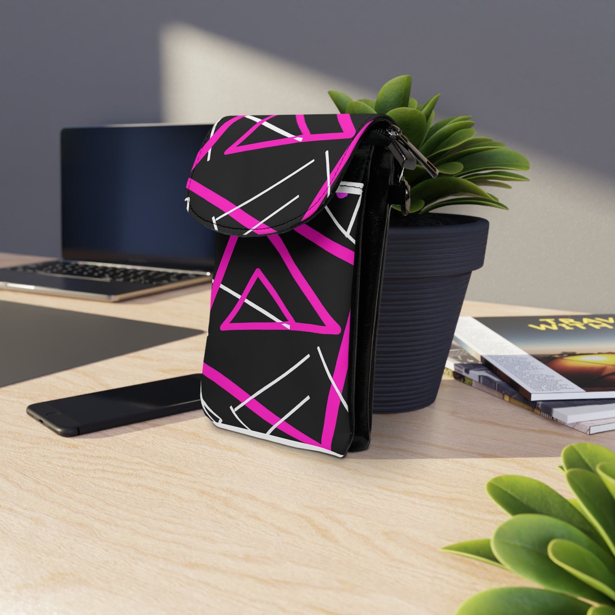 Black and pink geometric pattern crossbody cell phone wallet purse with adjustable strap and compartments for phone and cards.