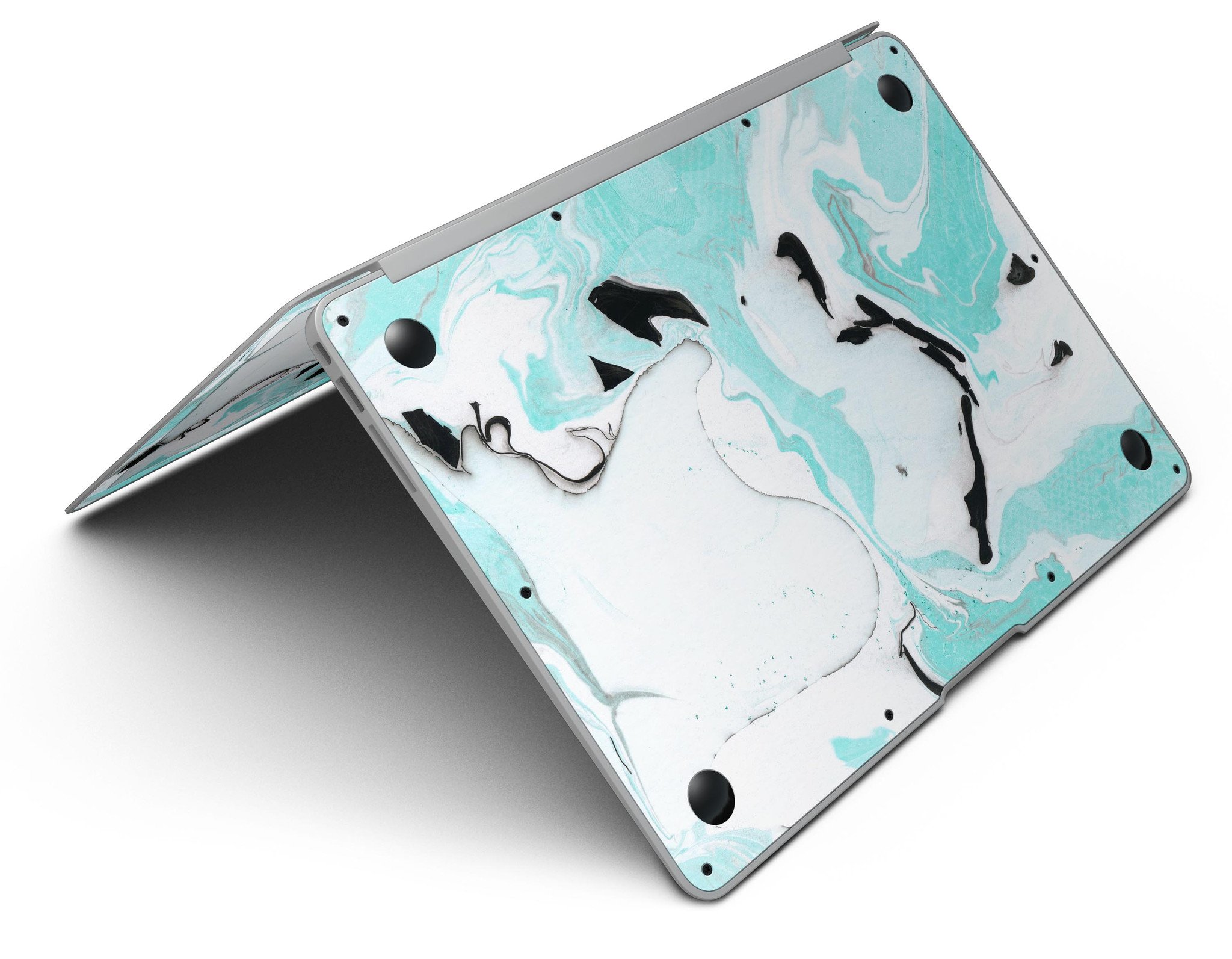 Black and teal textured marble skin applied to a MacBook Air, showcasing its stylish design and premium finish.