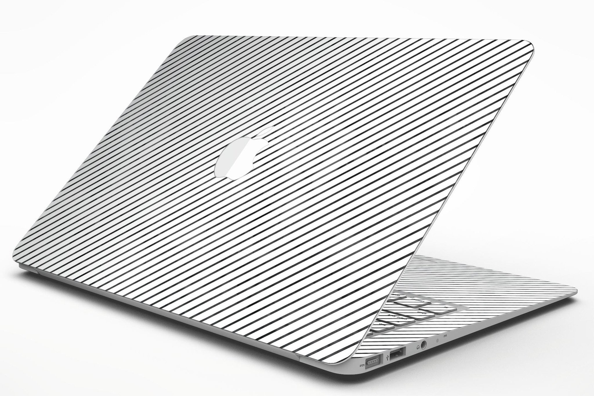 Black and white diagonal stripes skin kit for MacBook Air, showcasing a stylish design that protects the device from scratches.