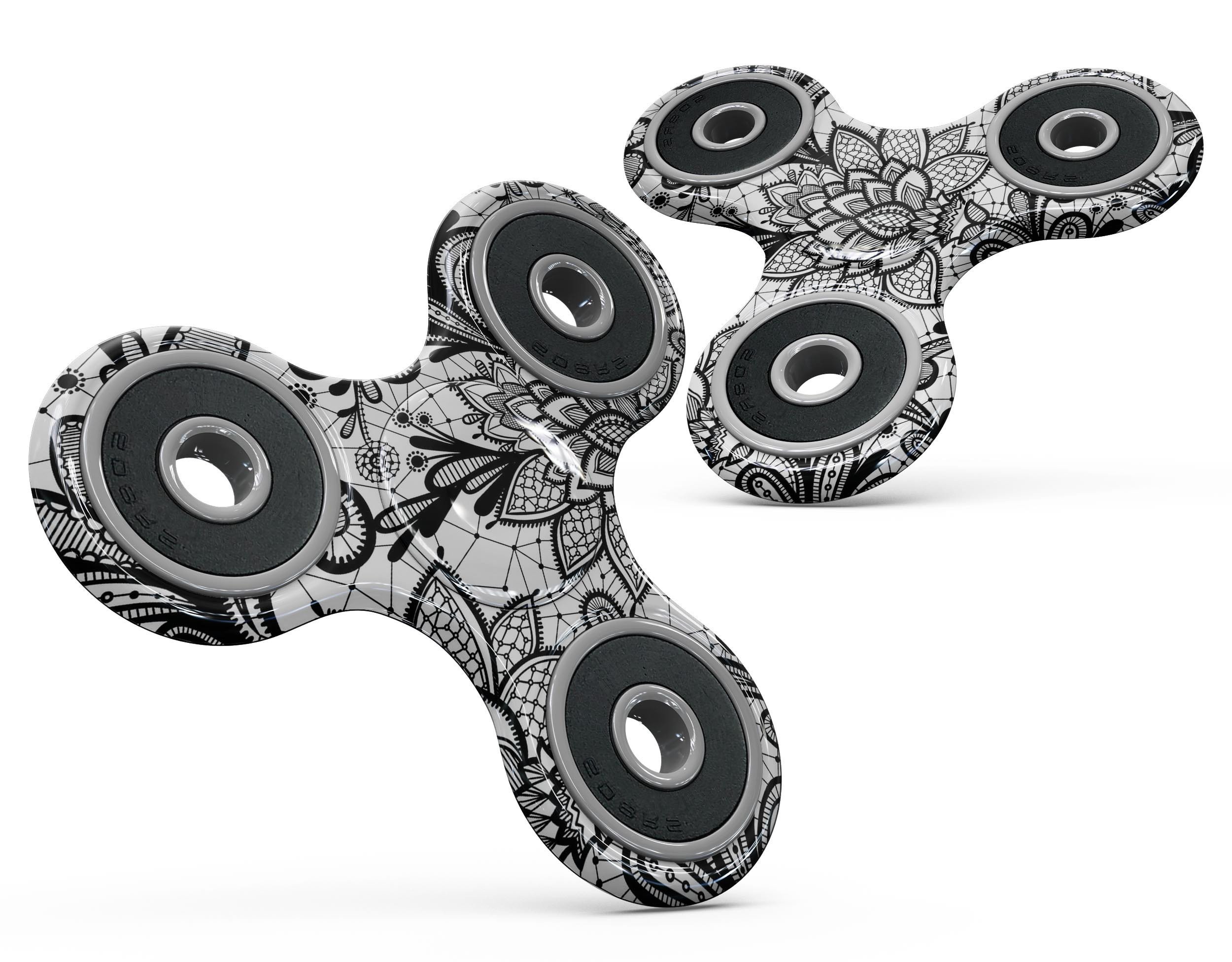 Black and white geometric floral design skin kit for fidget spinner, showcasing a stylish and protective vinyl cover.