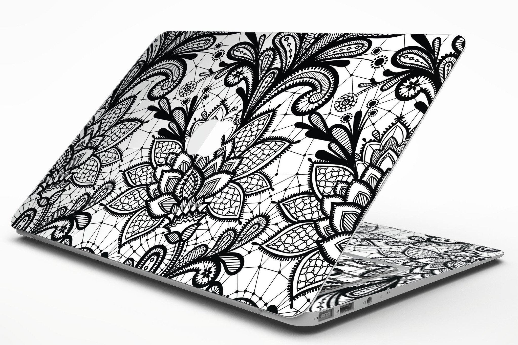 Black and white geometric floral skin for MacBook Air, showcasing a stylish design that protects the device.