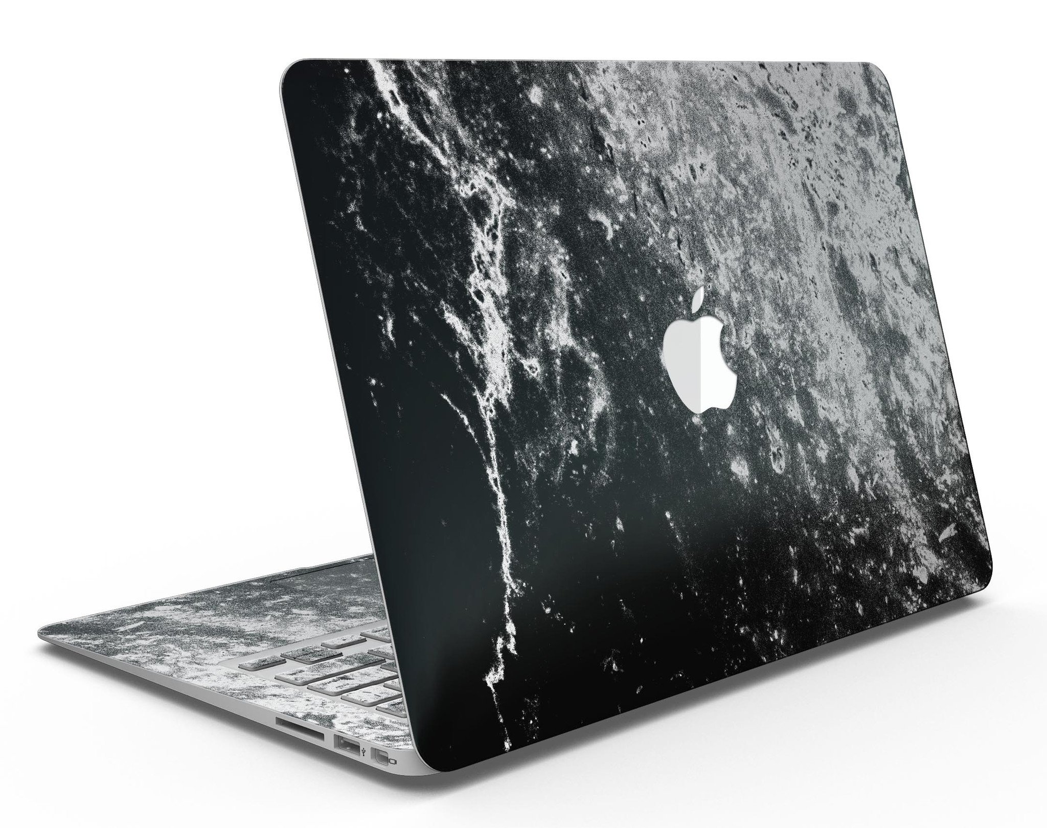 Black and white grungy marble skin applied to a MacBook Air, showcasing its stylish design and sleek finish.