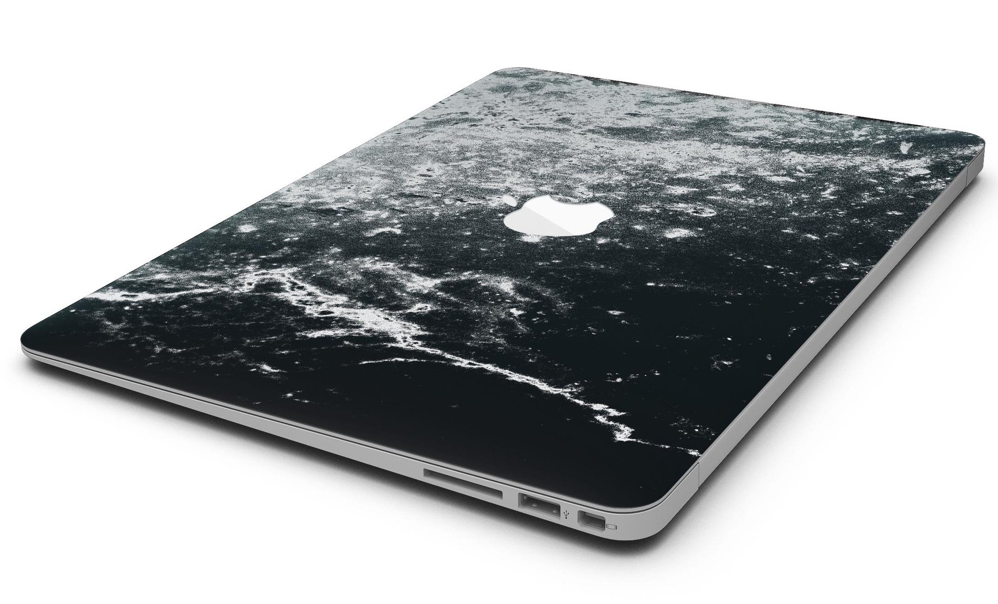 Black and white grungy marble skin applied to a MacBook Air, showcasing its stylish design and sleek finish.