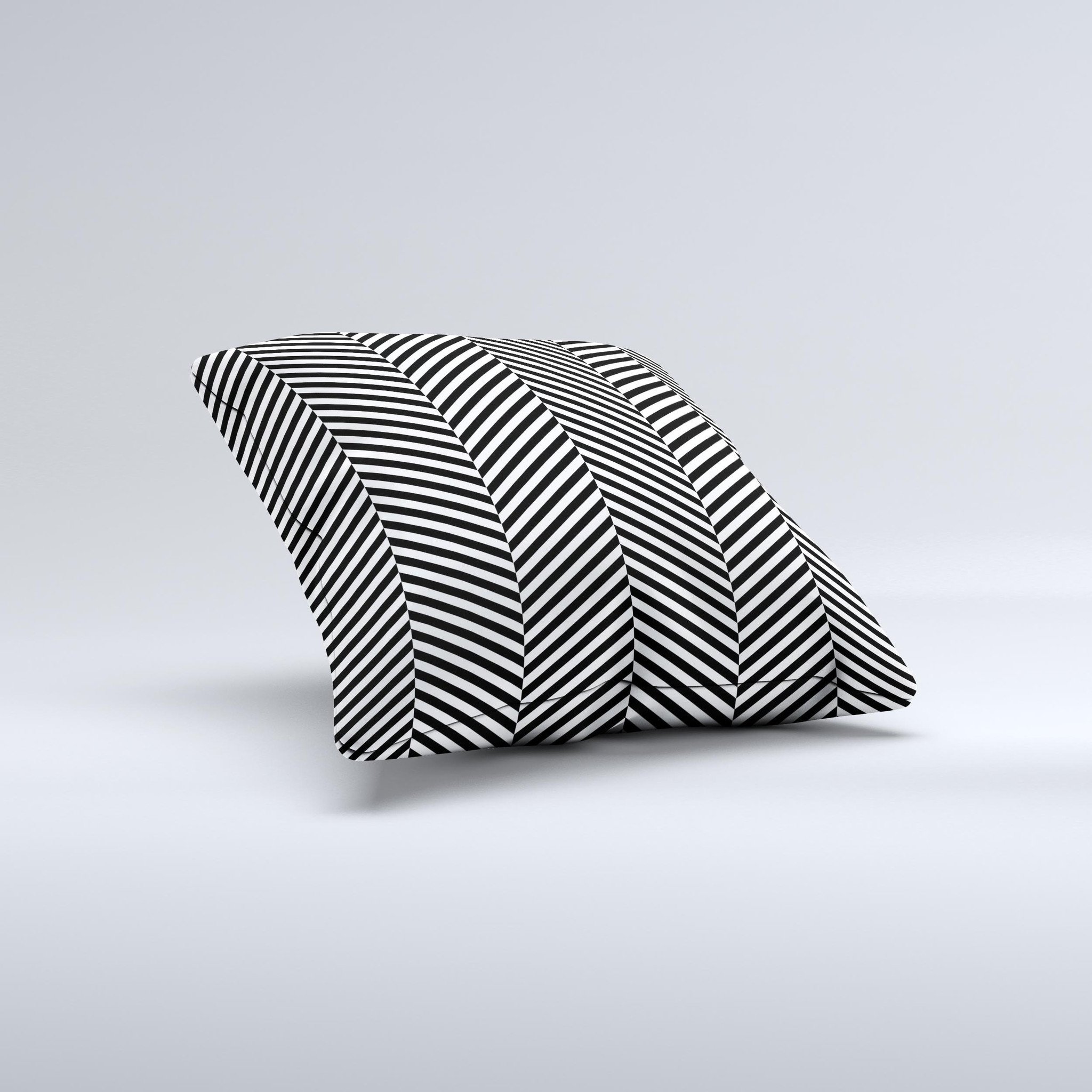 Black and white decorative throw pillow with opposite stripes, handcrafted in Virginia, showcasing unique artisanal design.