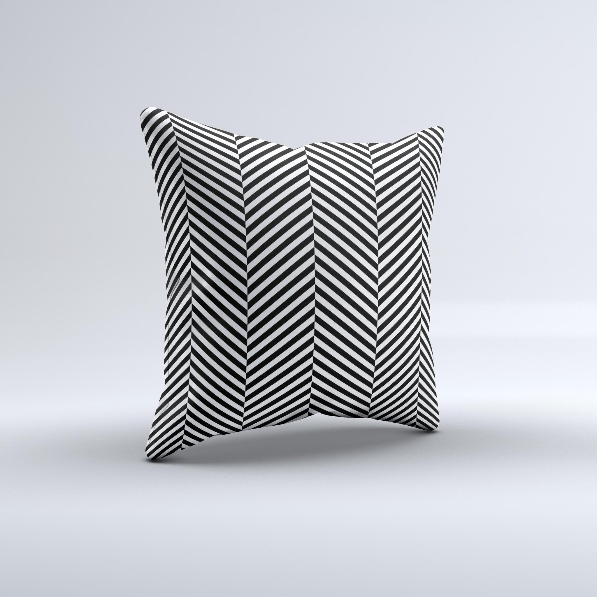 Black and white decorative throw pillow with opposite stripes, handcrafted in Virginia, showcasing unique artisanal design.