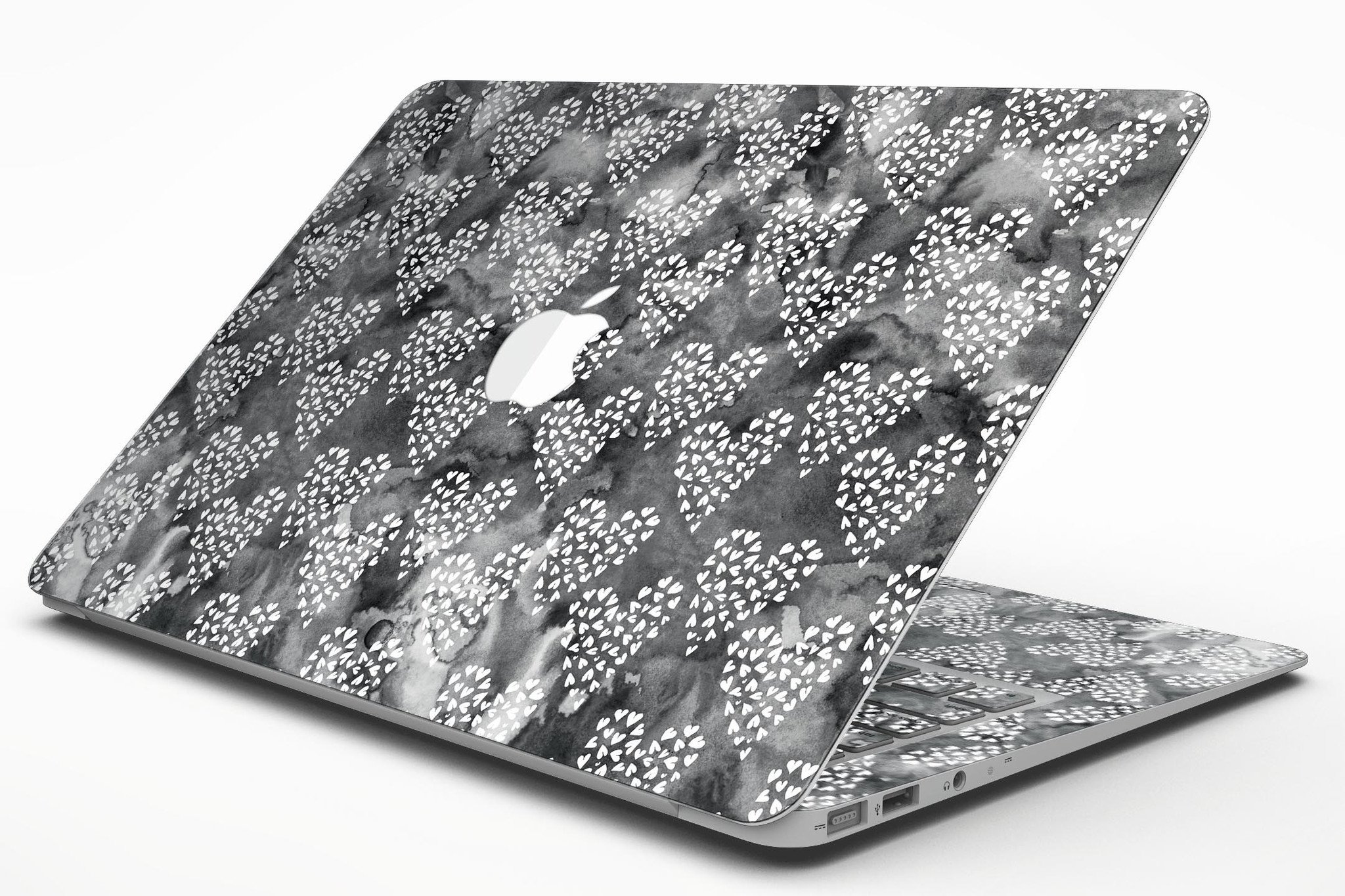 Black and white watercolor hearts design MacBook Air skin kit, showcasing a stylish and protective vinyl cover.