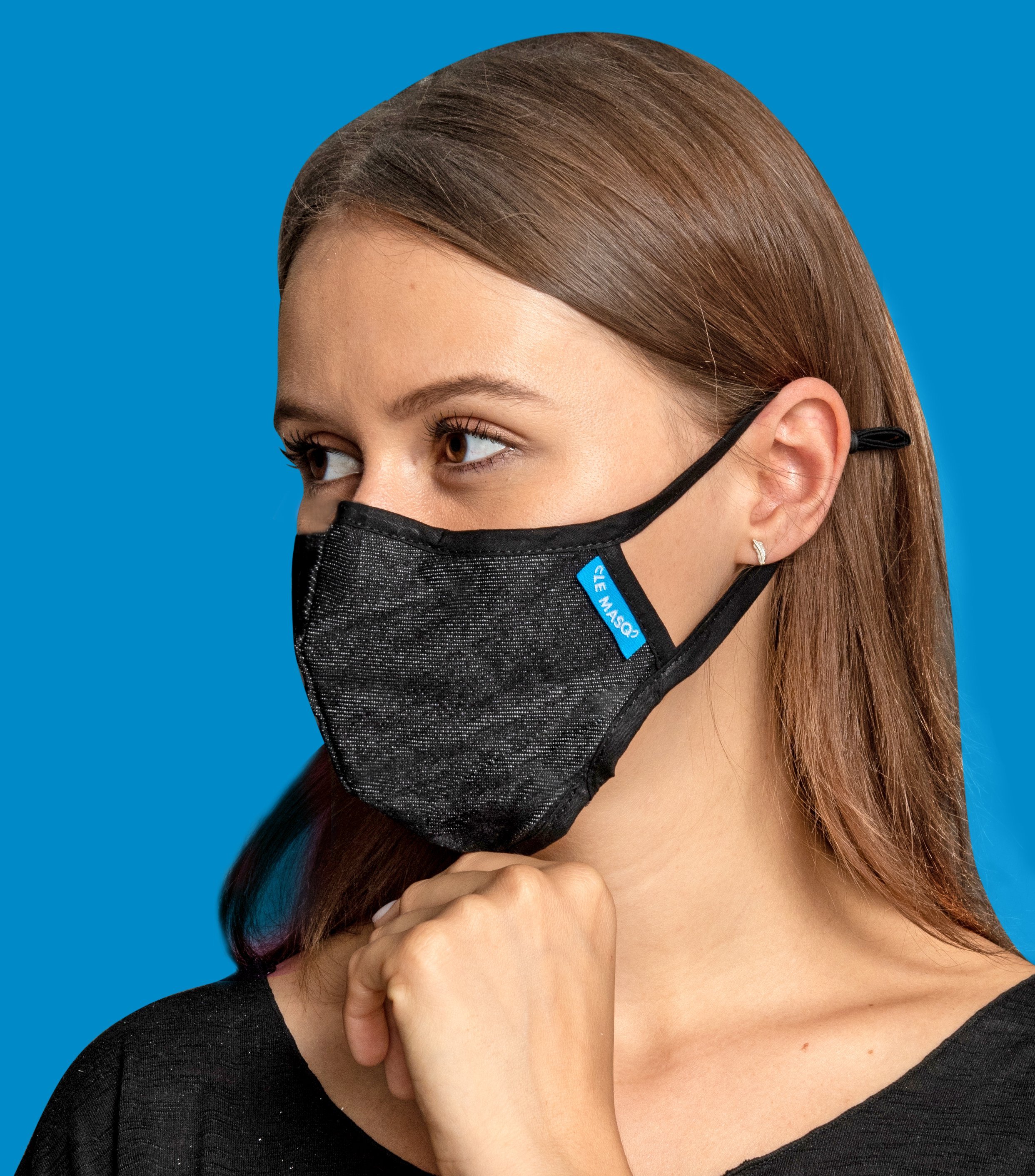 Black Canvas Mask featuring a breathable design with adjustable ear toggles and a removable inner layer for added comfort.