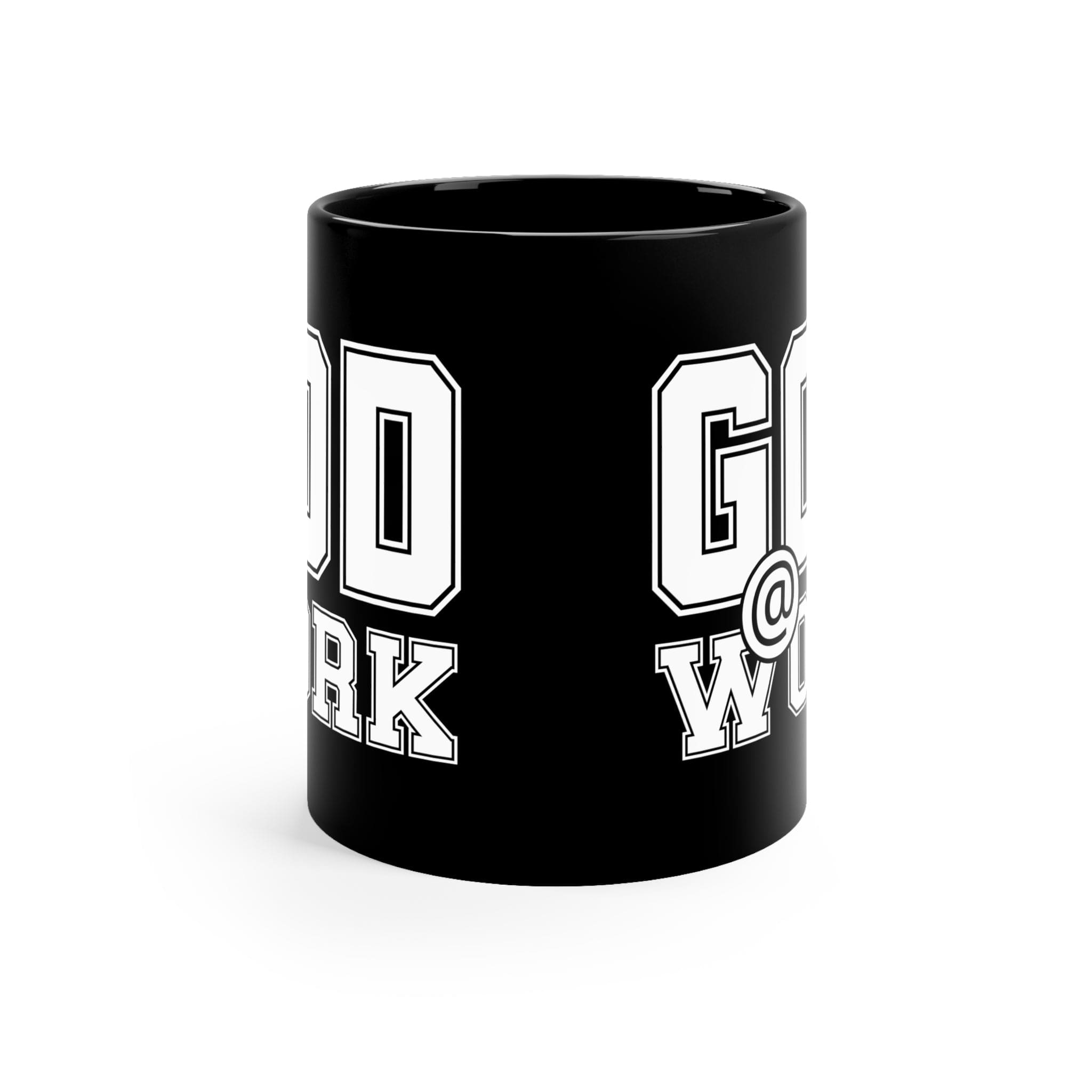 A stylish black ceramic mug with a glossy finish, featuring a white print that says 'God @ Work', perfect for coffee or tea.