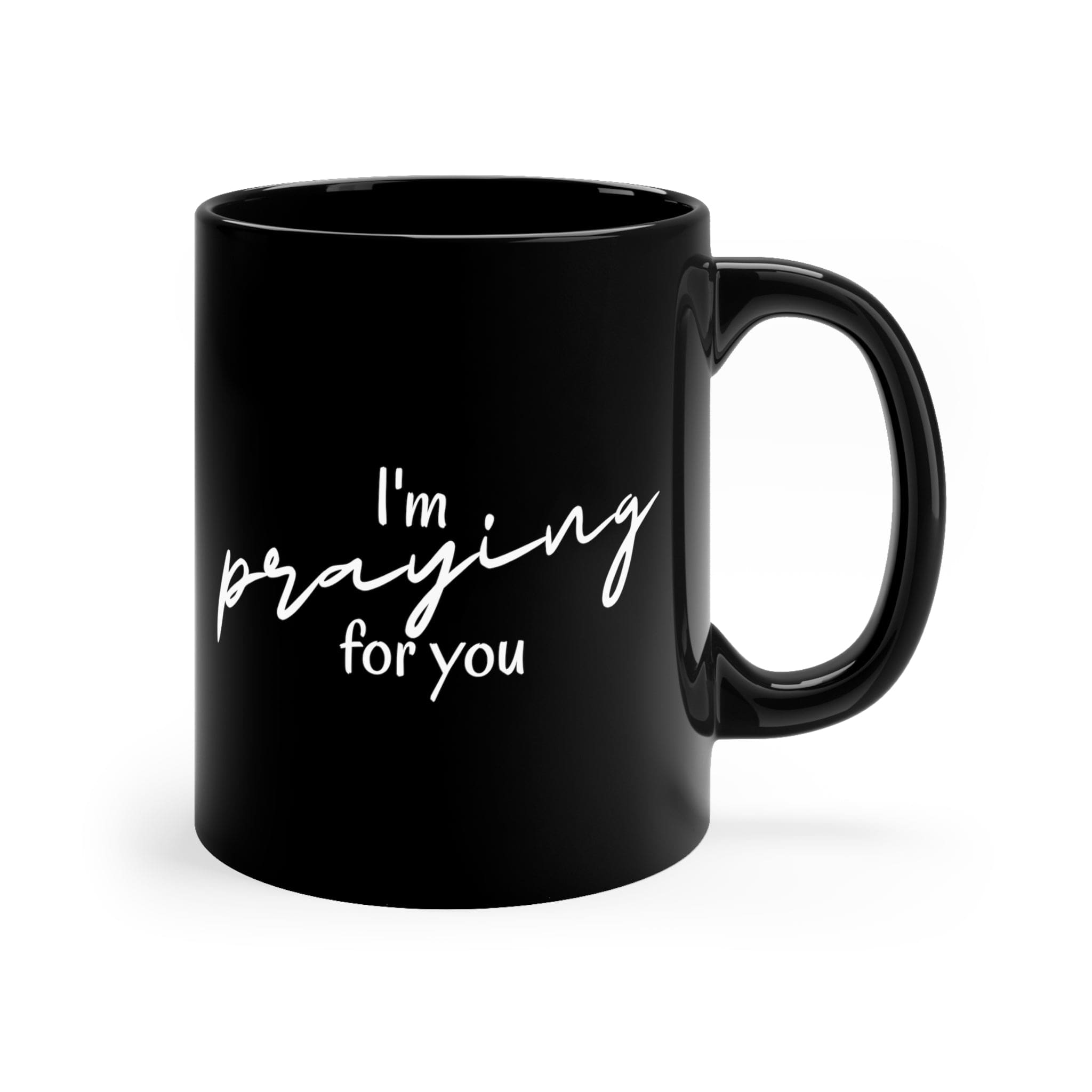 A sleek black ceramic mug with a glossy finish, featuring a C-shaped handle, perfect for coffee or tea.