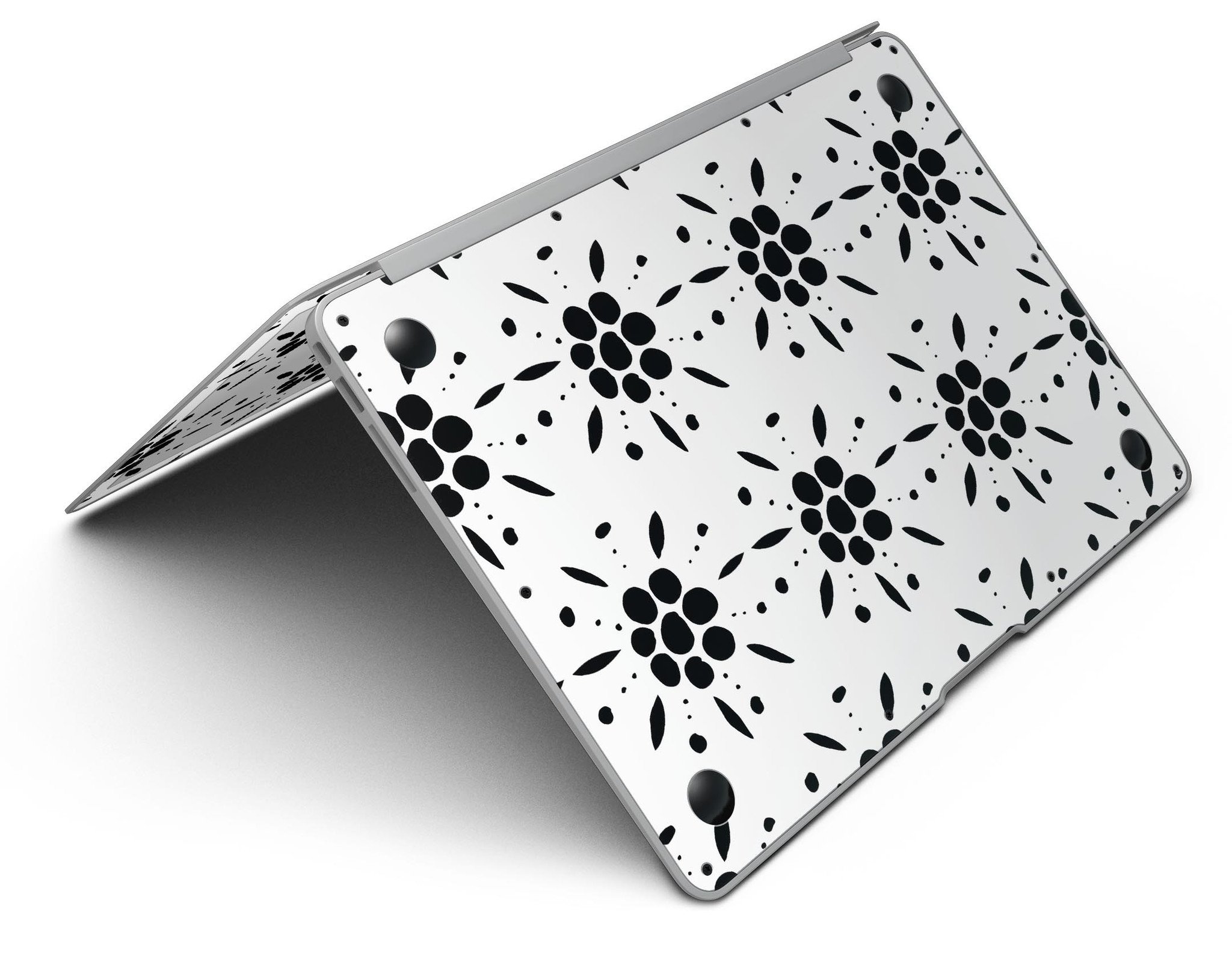 Black Floral Pedals MacBook Air skin kit showcasing a stylish design with clear cacking for protection.