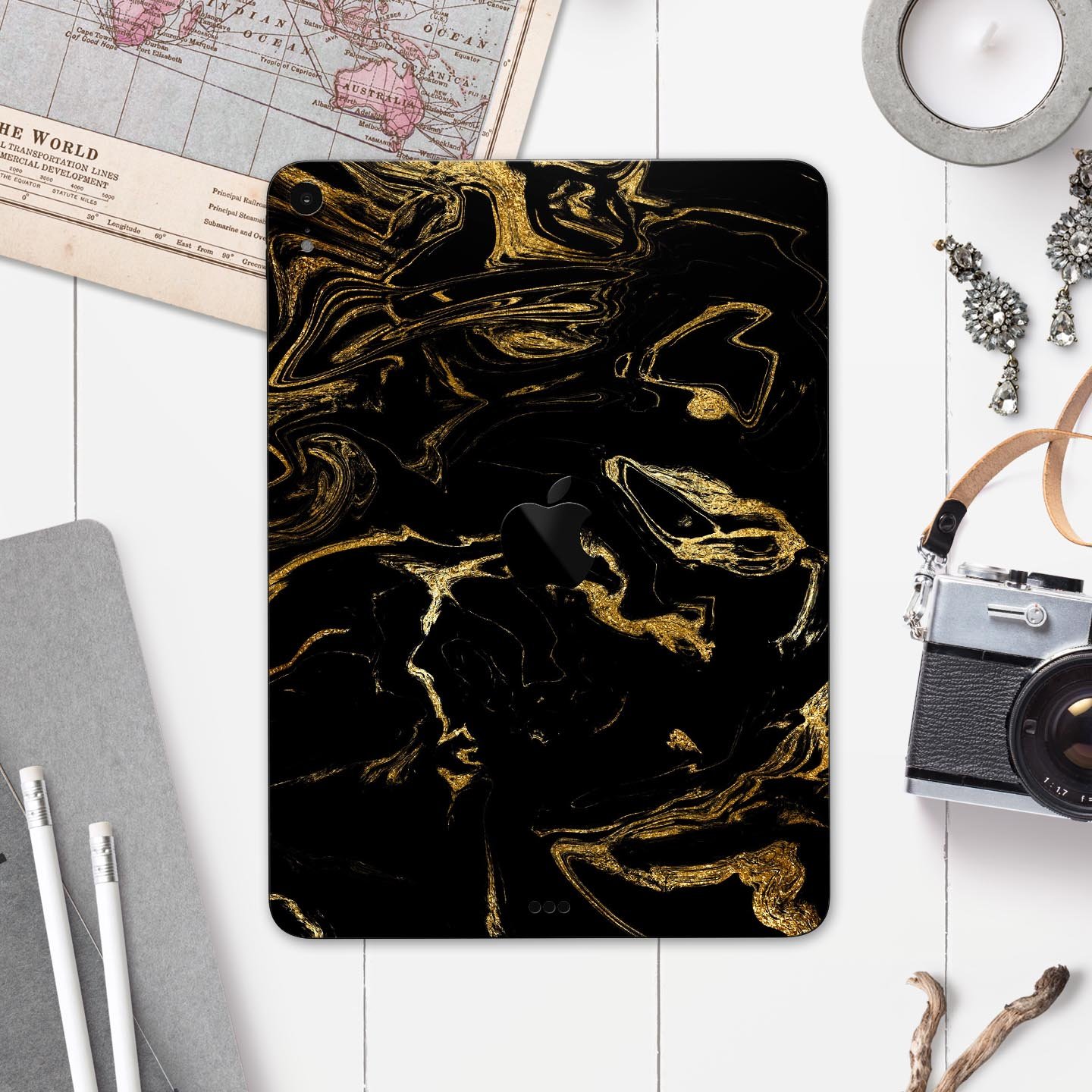 Black and gold marble swirl skin decal for Apple iPad, showcasing a stylish design with premium 3M material for protection.