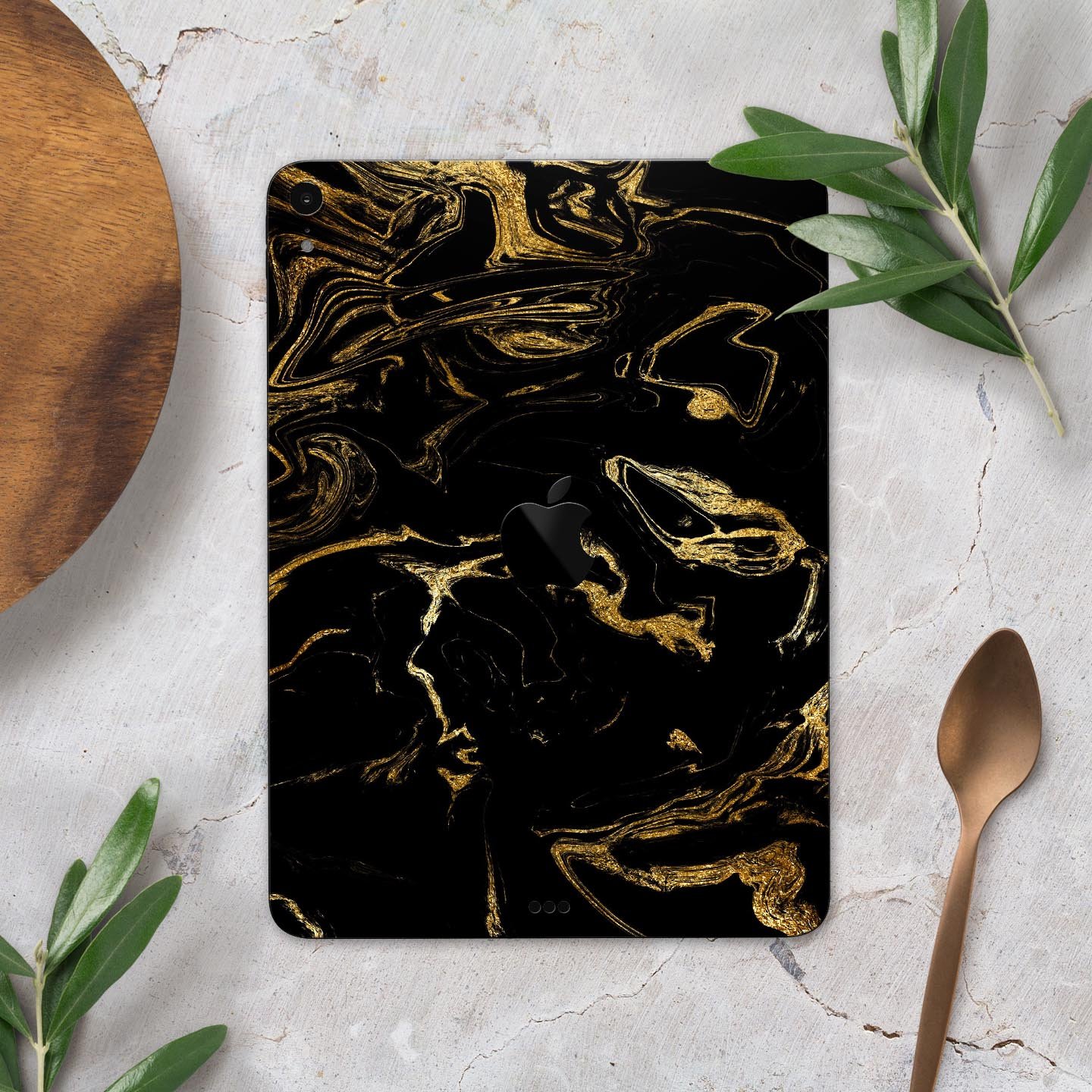 Black and gold marble swirl skin decal for Apple iPad, showcasing a stylish design with premium 3M material for protection.