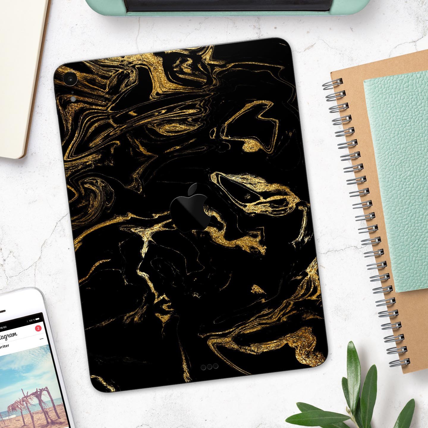 Black and gold marble swirl skin decal for Apple iPad, showcasing a stylish design with premium 3M material for protection.