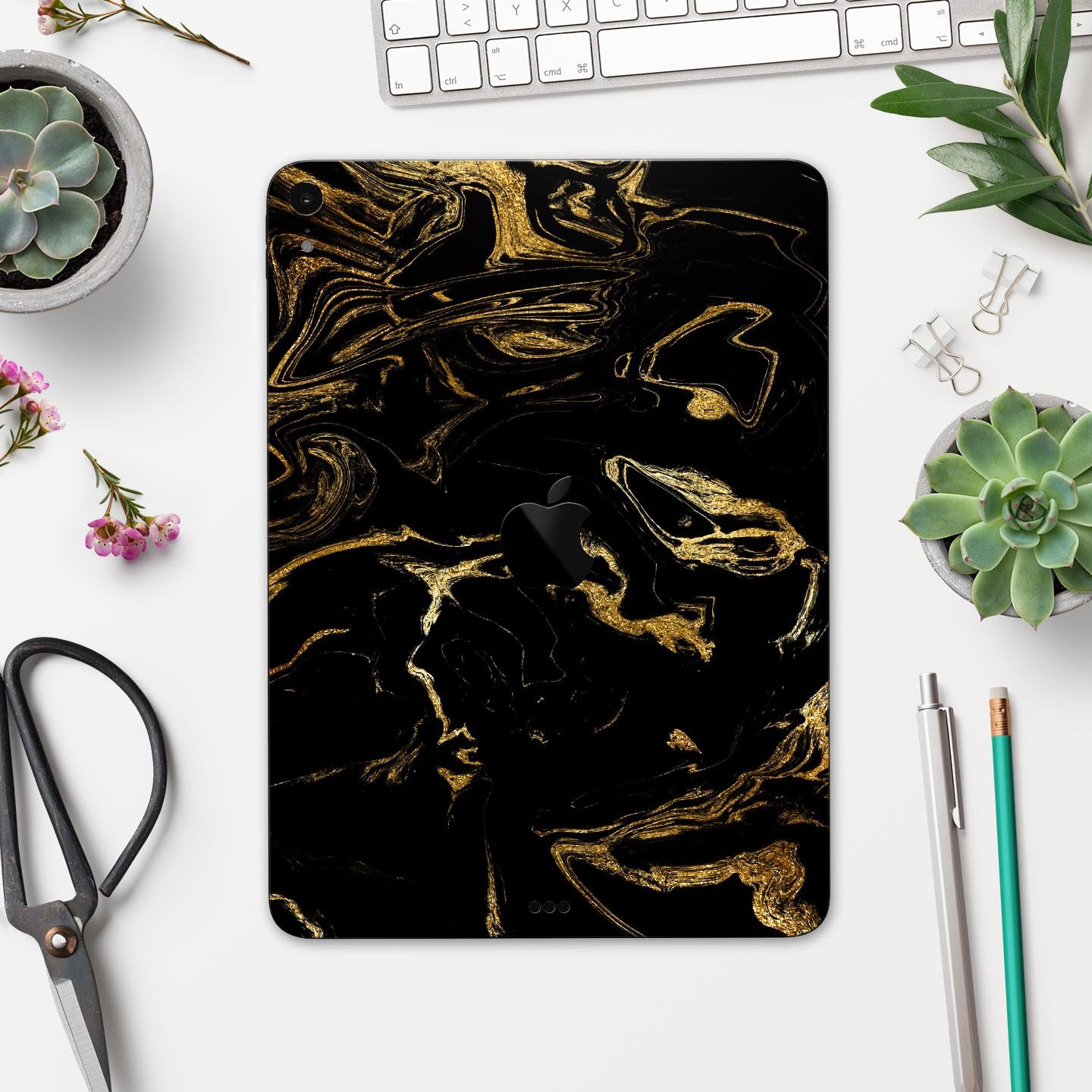 Black and gold marble swirl skin decal for Apple iPad, showcasing a stylish design with premium 3M material for protection.