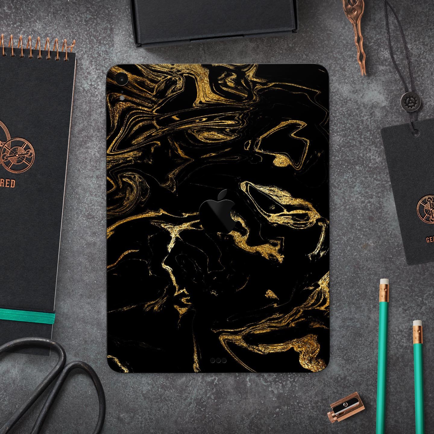 Black and gold marble swirl skin decal for Apple iPad, showcasing a stylish design with premium 3M material for protection.