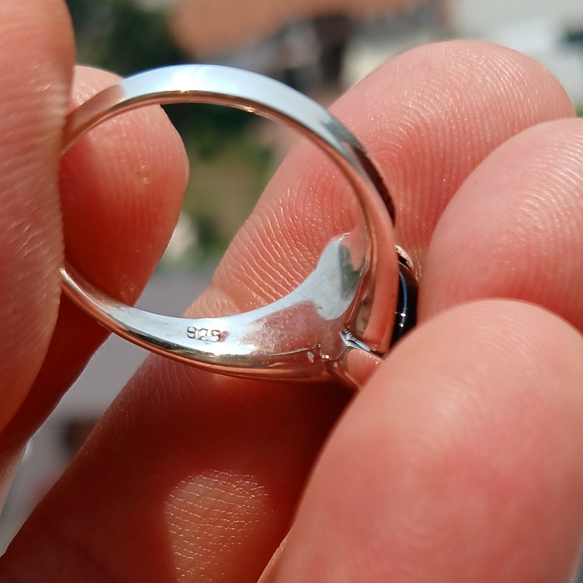 A beautiful Black Onyx Ring made of sterling silver, featuring a marquise shaped black Onyx gemstone with a polished finish.