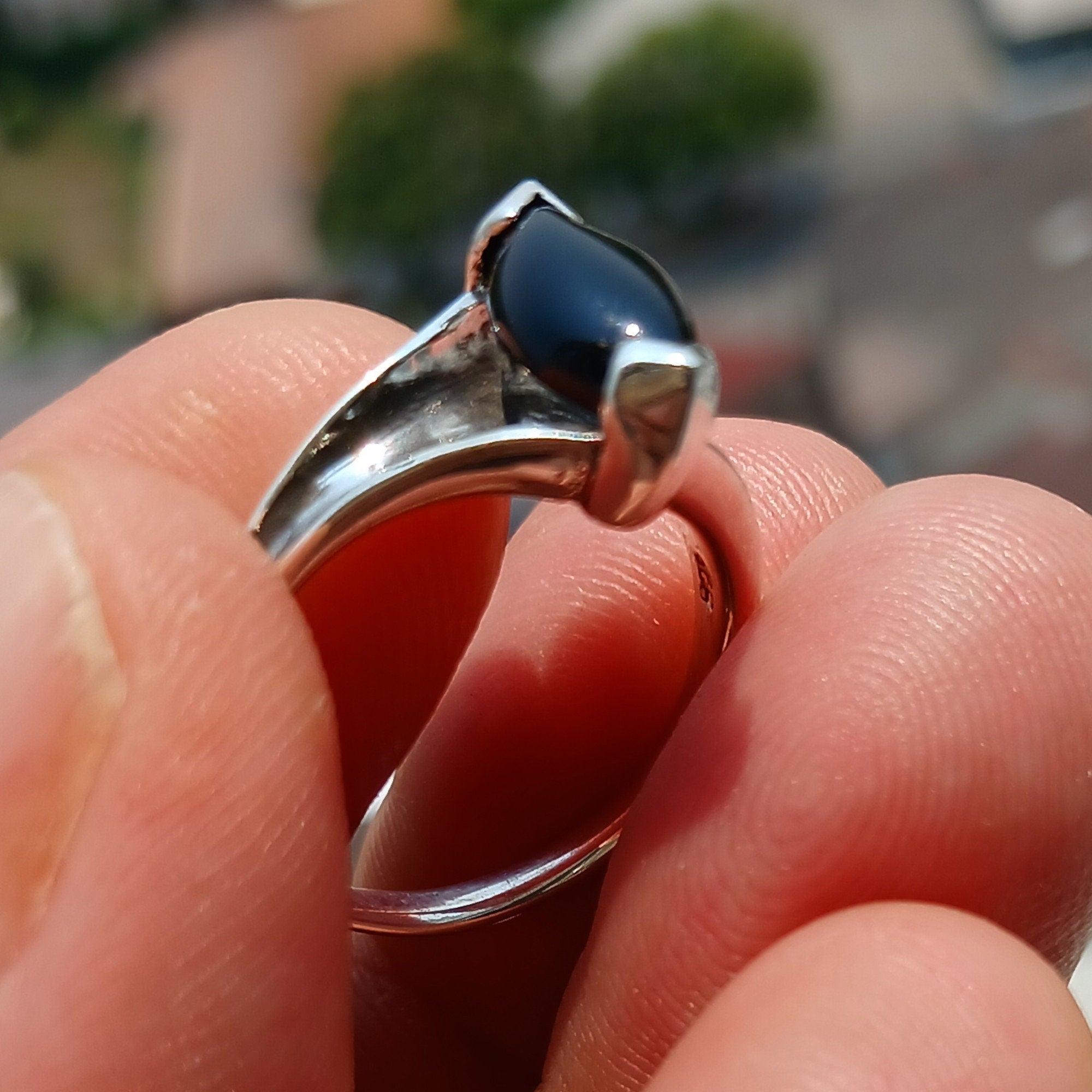 A beautiful Black Onyx Ring made of sterling silver, featuring a marquise shaped black Onyx gemstone with a polished finish.