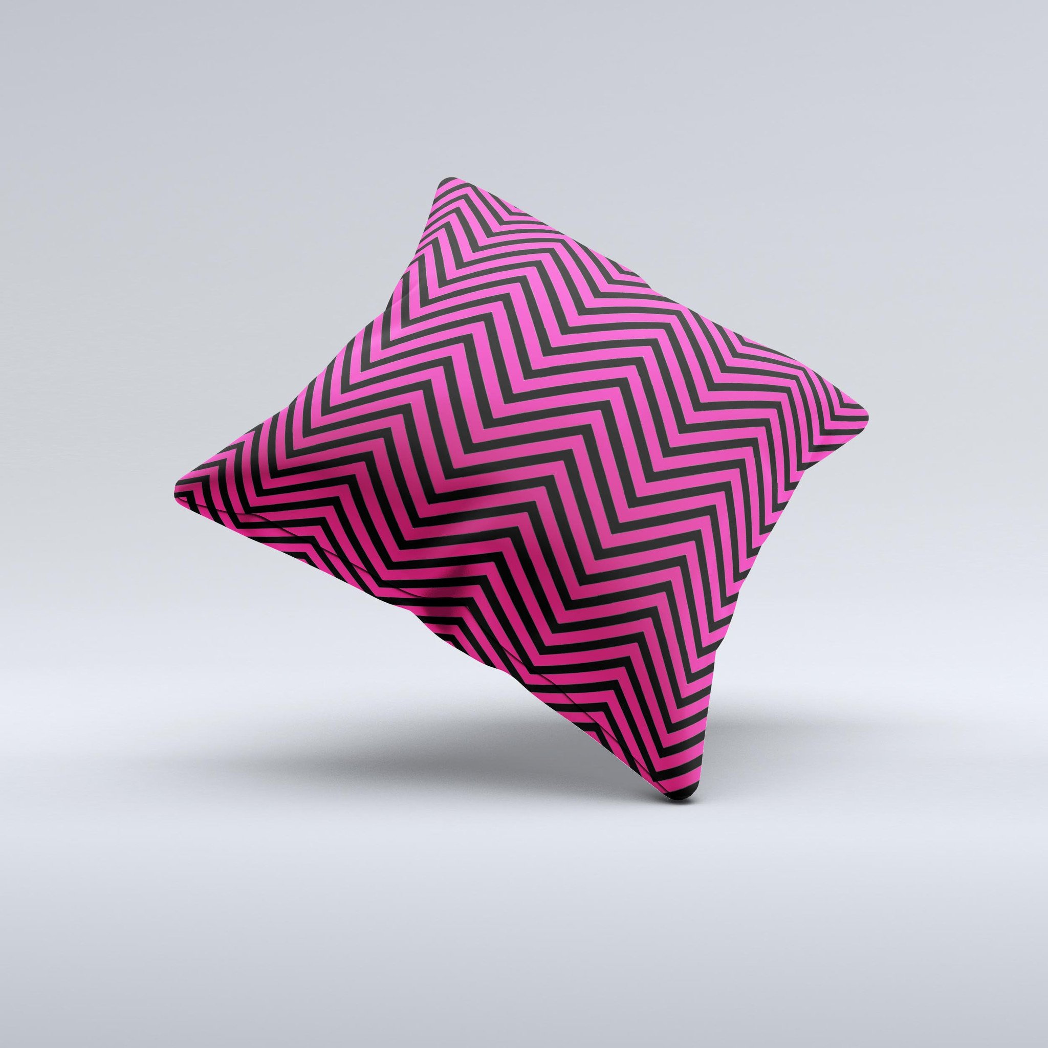 Black and pink decorative throw pillow featuring a sharp chevron pattern, handcrafted with high-quality materials.