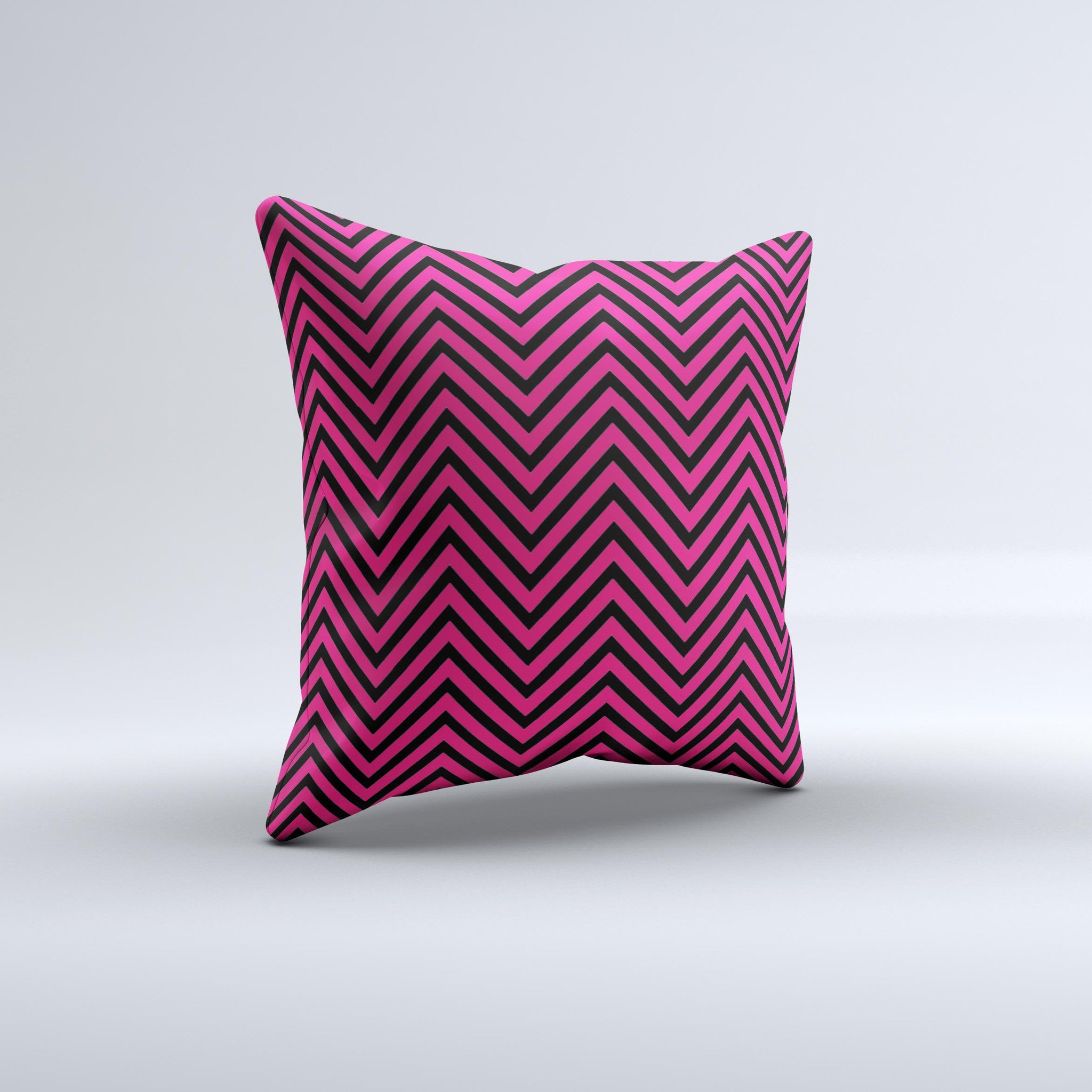 Black and pink decorative throw pillow featuring a sharp chevron pattern, handcrafted with high-quality materials.