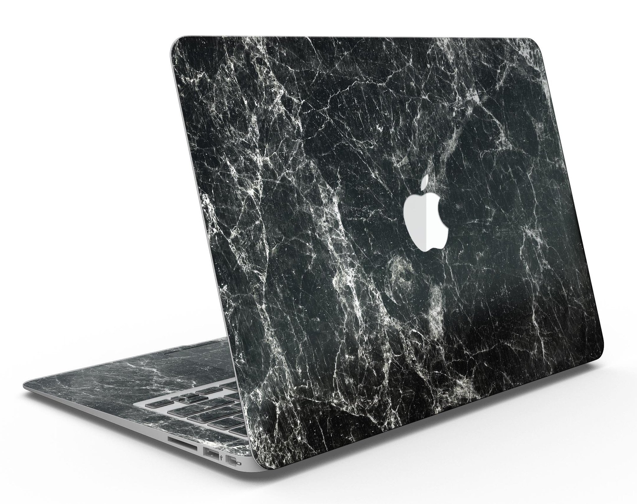 Black Scratched Marble skin applied to a MacBook Air, showcasing its stylish design and sleek finish.