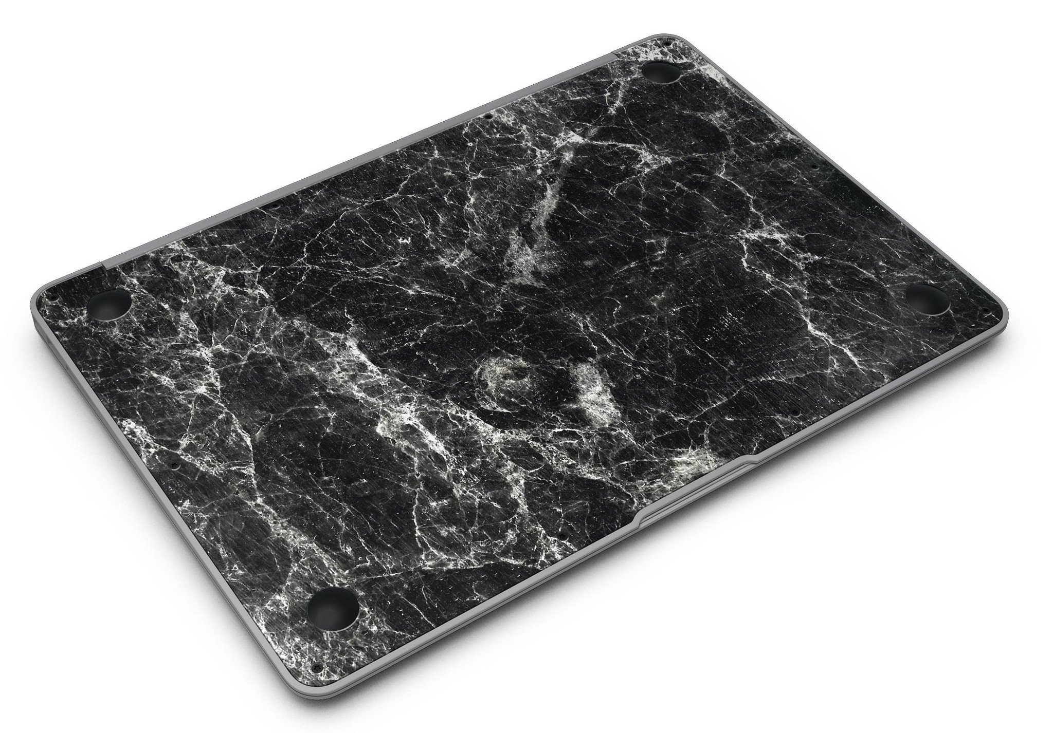 Black Scratched Marble skin applied to a MacBook Air, showcasing its stylish design and sleek finish.