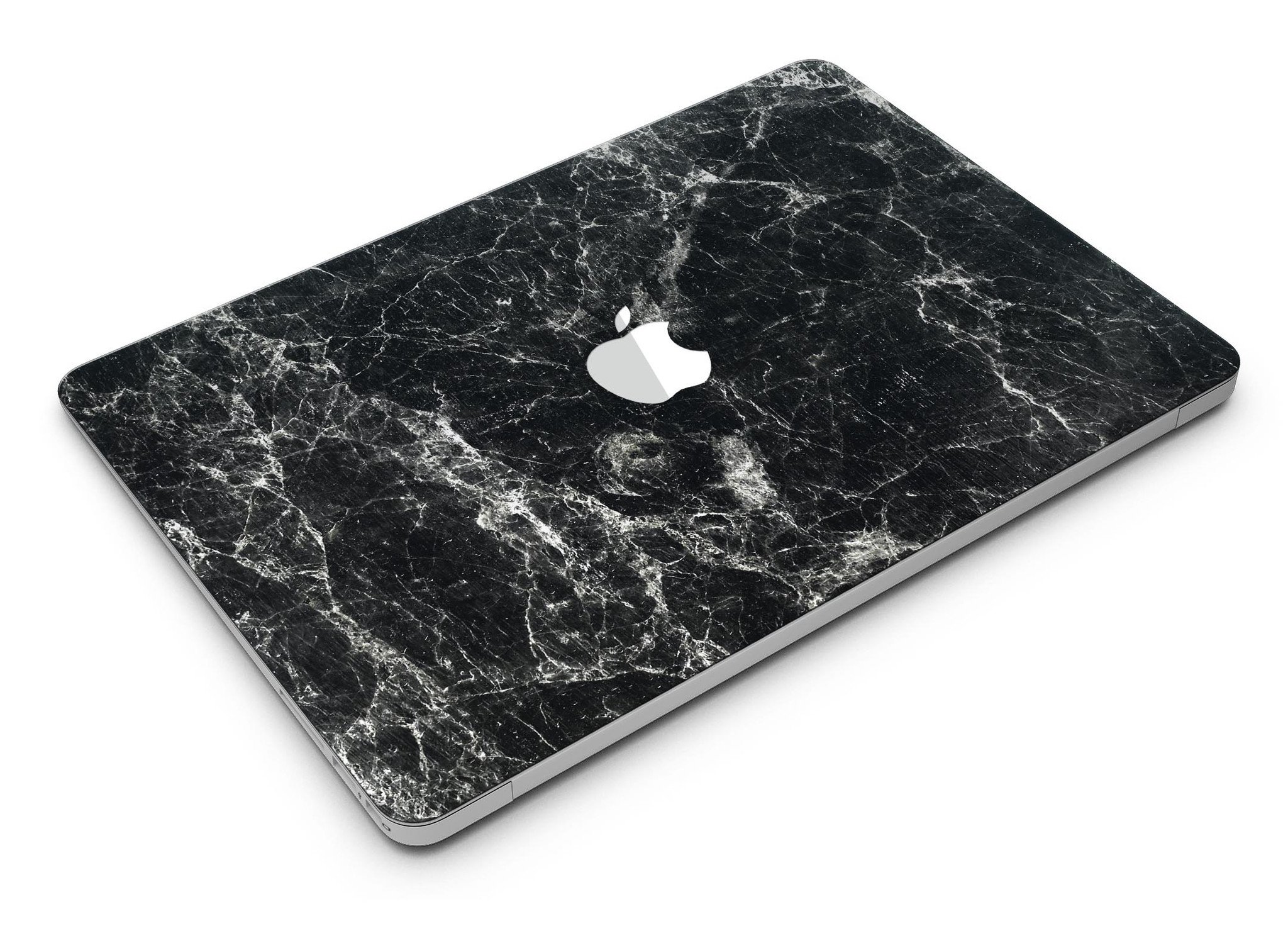 Black Scratched Marble skin applied to a MacBook Air, showcasing its stylish design and sleek finish.