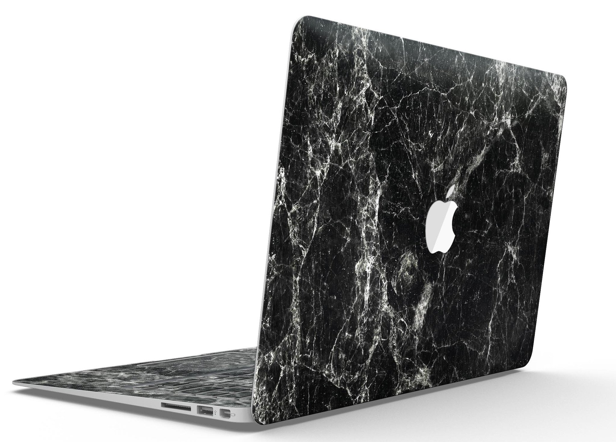 Black Scratched Marble skin applied to a MacBook Air, showcasing its stylish design and sleek finish.