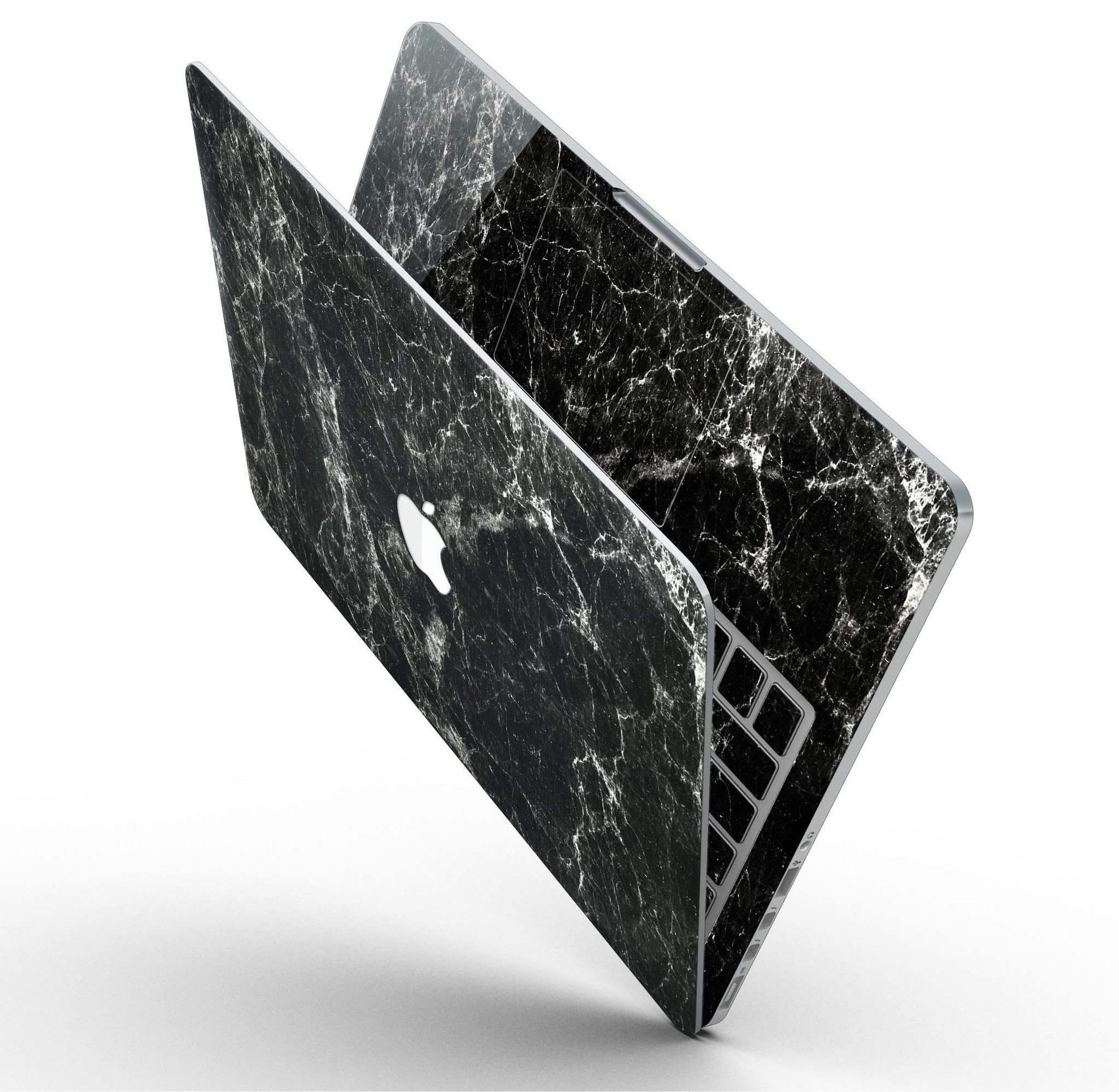 Marble-patterned MacBook partially open.