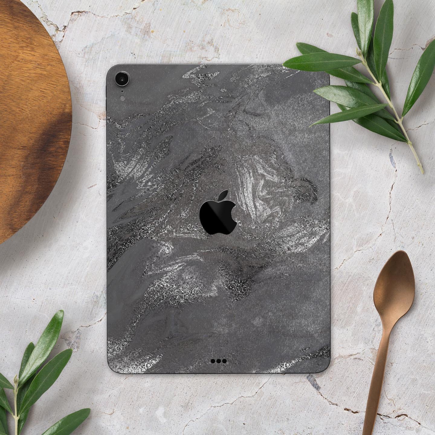 Black and silver marble swirl skin decal for Apple devices, showcasing a stylish design with a premium finish.